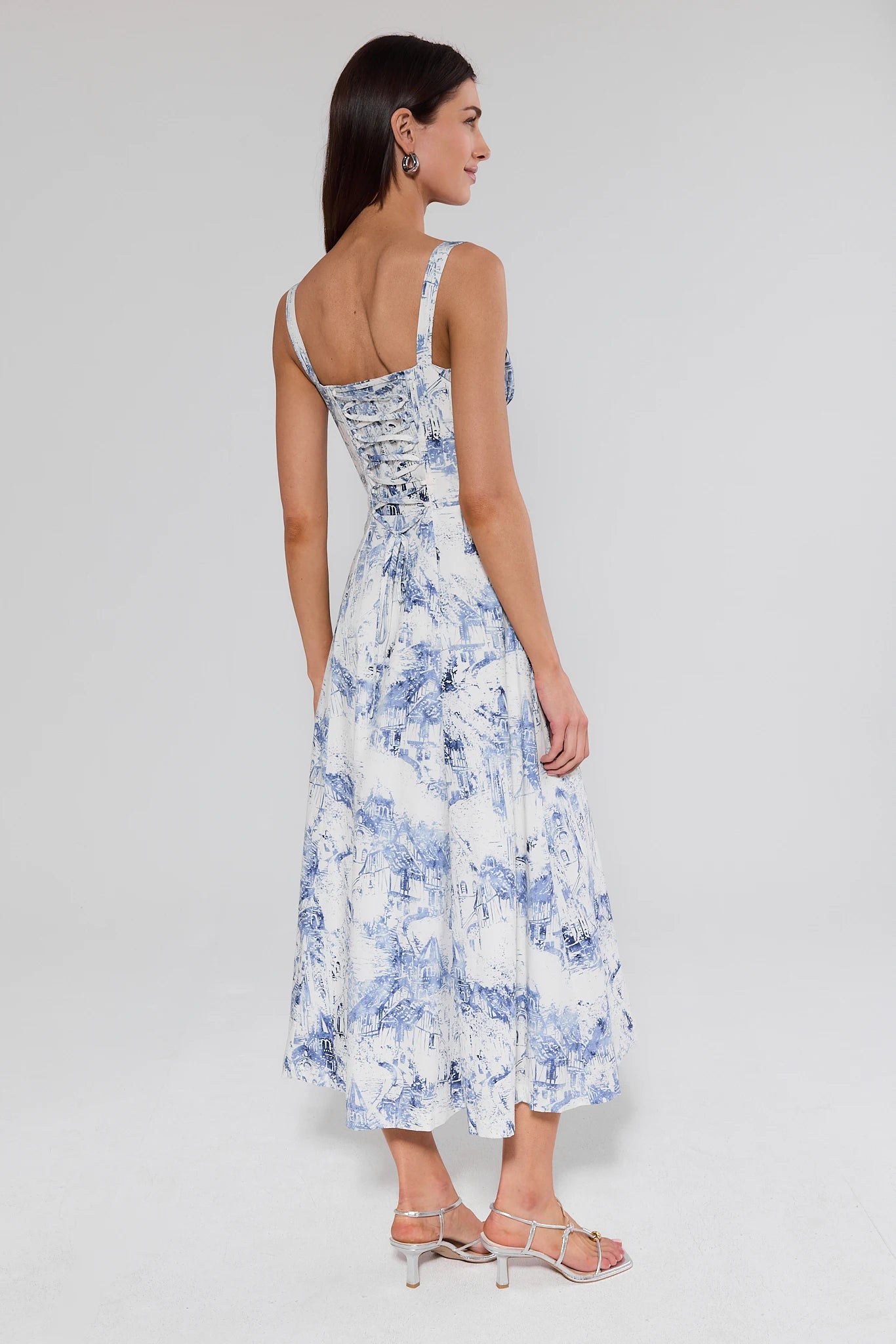 Woman wearing a floral dress on a white background