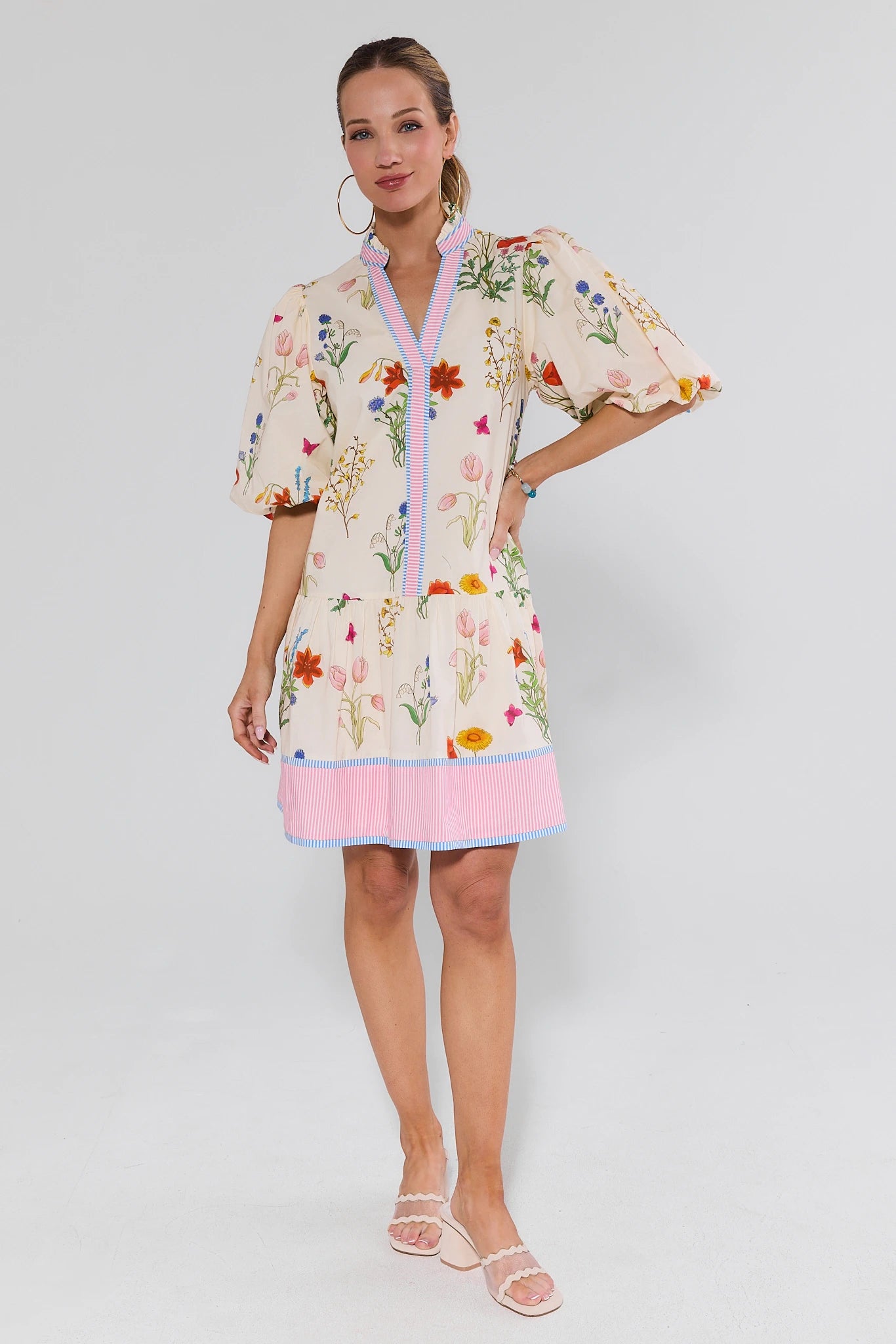 Woman wearing a floral dress with a white background