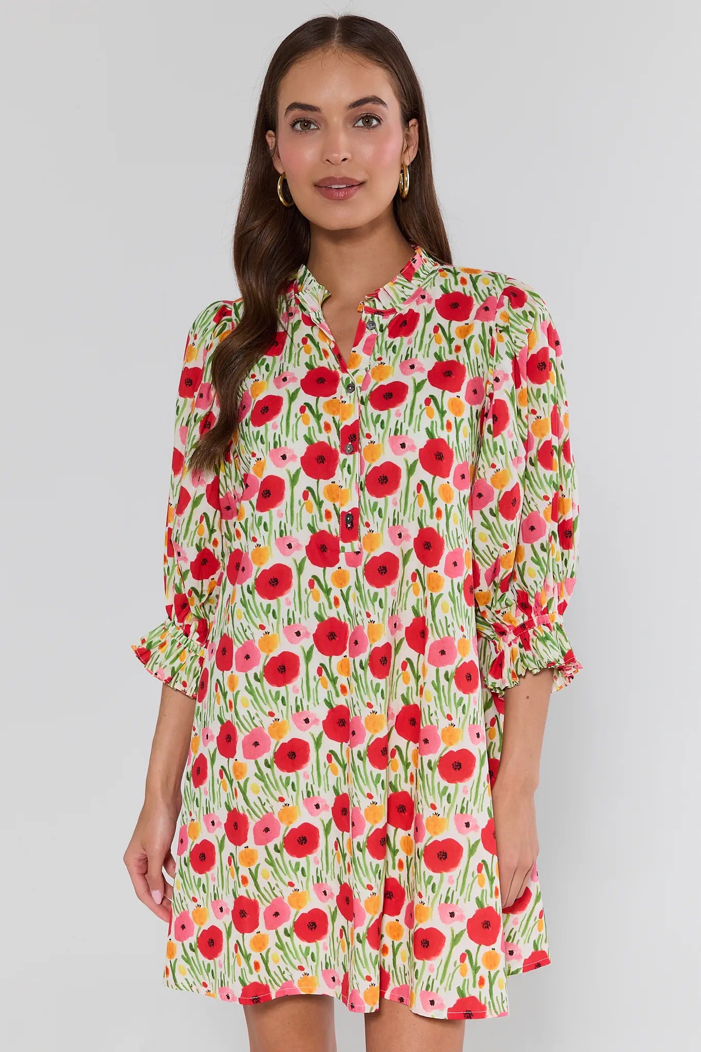 Woman wearing a floral dress with a white background