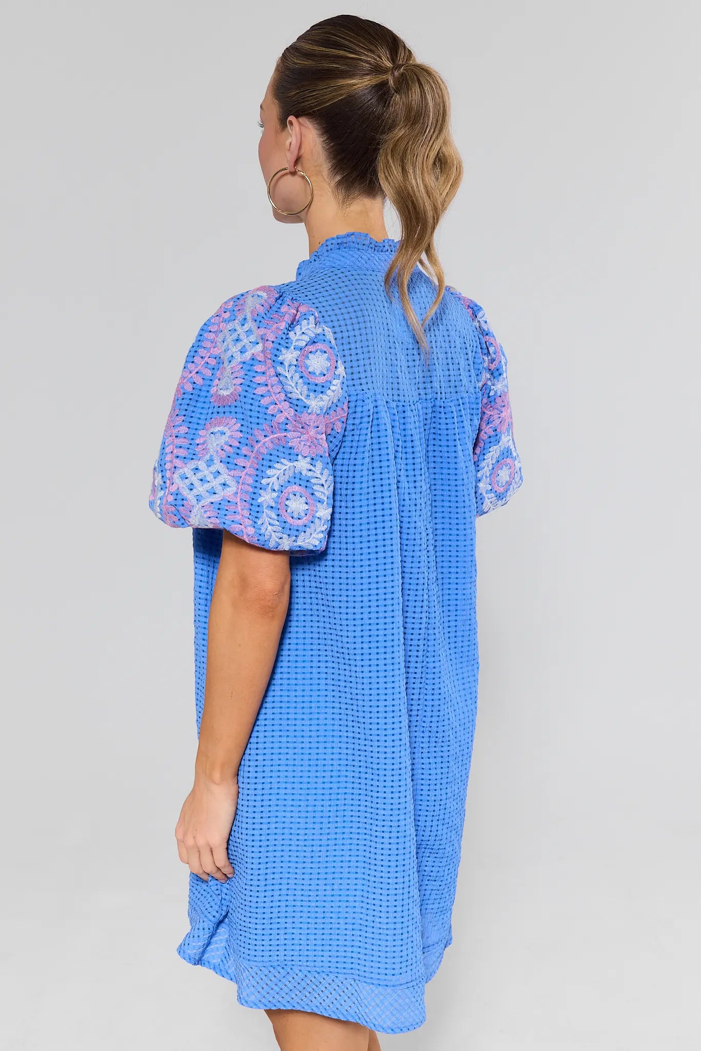 woman standing wearing camilia dress