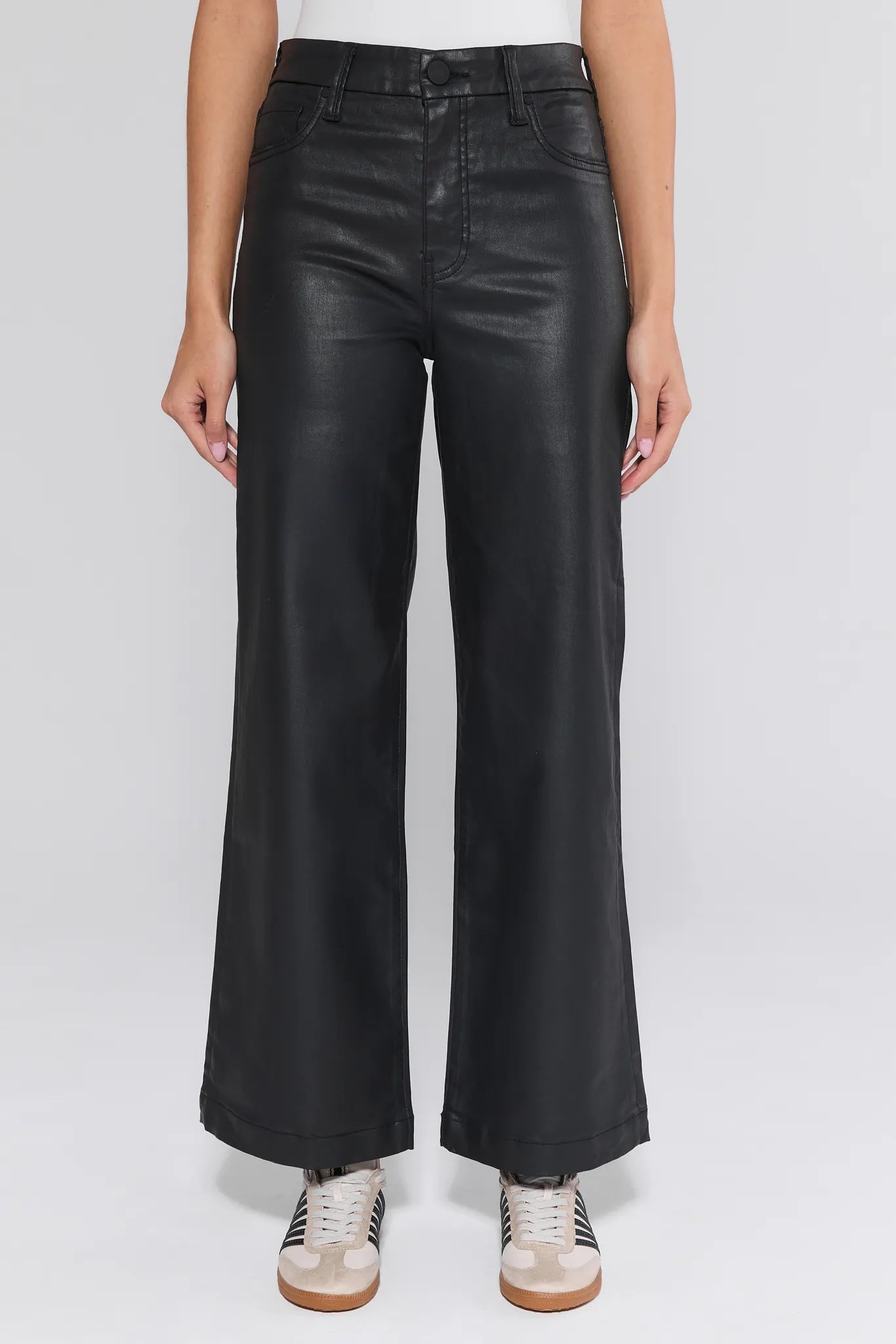 Black Meg Jeans Wax Coated worn by a person on a white background