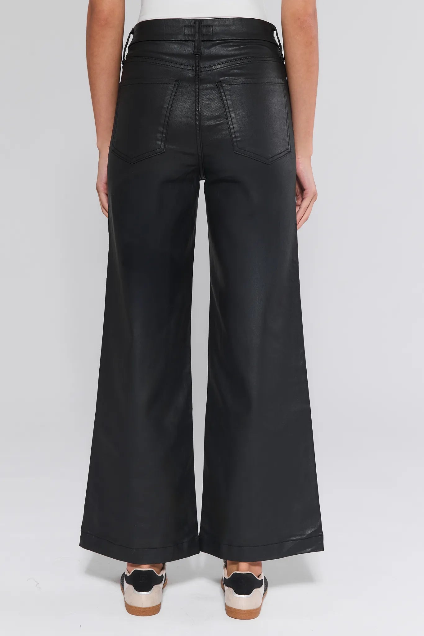 Black Meg Jeans Wax Coated worn by a person on a white background