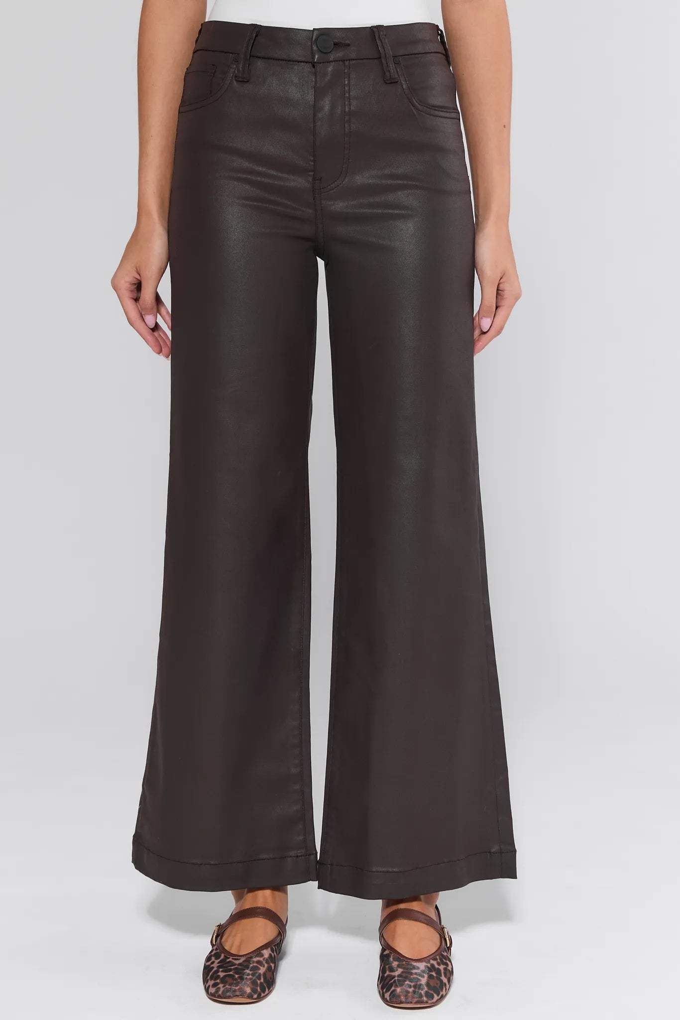 Dark brown Meg Jeans Wax Coated worn by a person on a white background