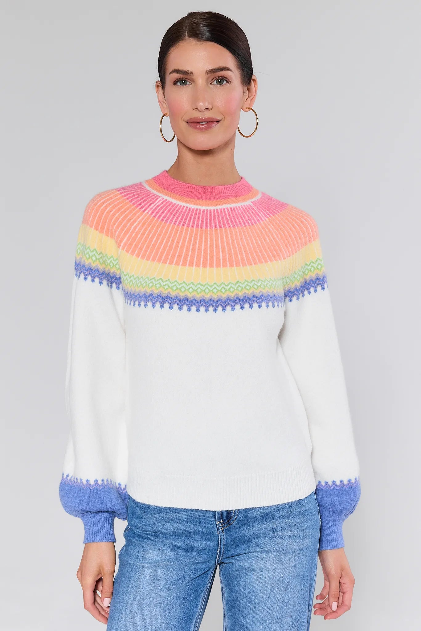 Woman wearing a Kate Multi Color Fair Isle Sweater with a plain background