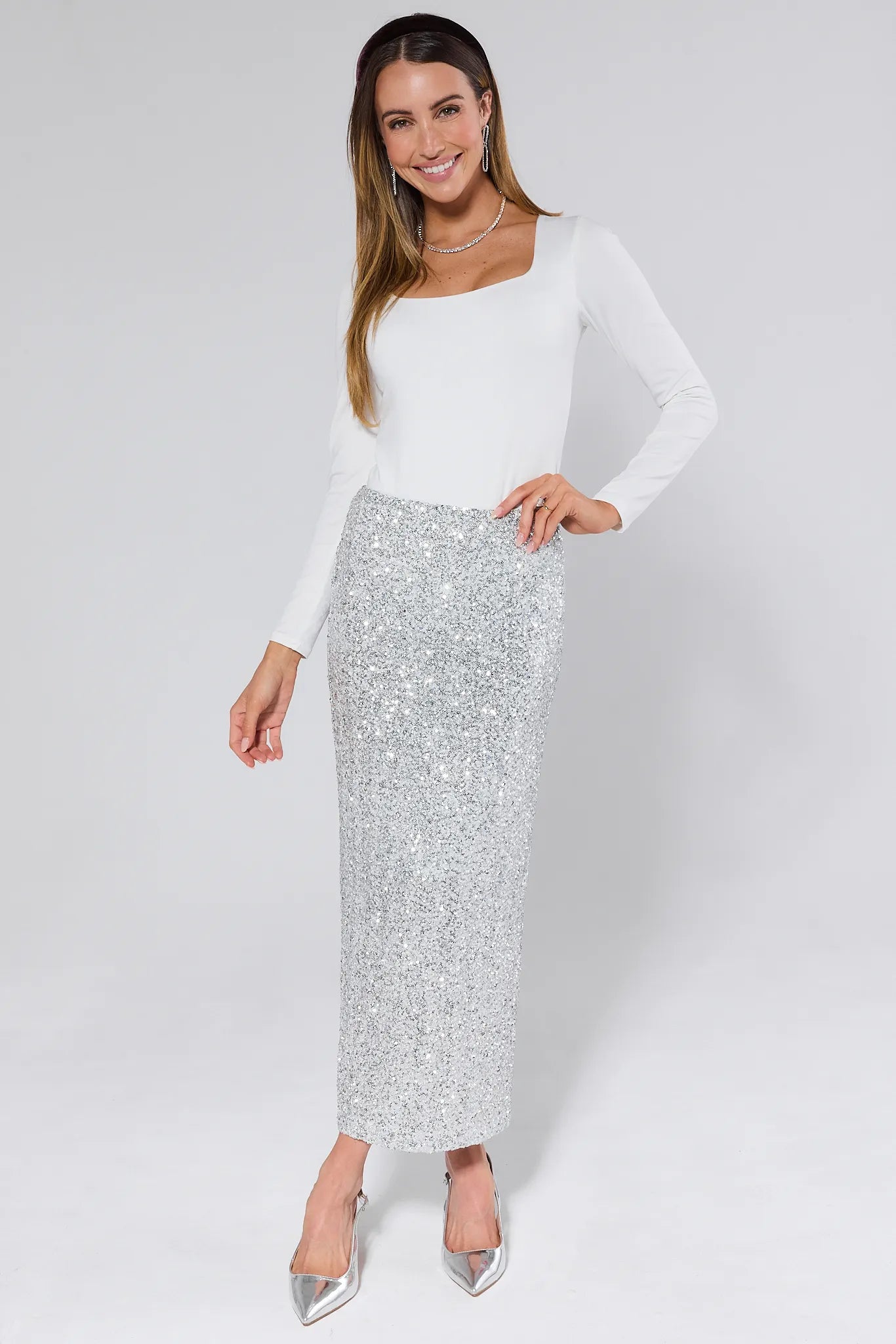 Stella Silver Sequin Maxi Skirt worn by a person on a plain background