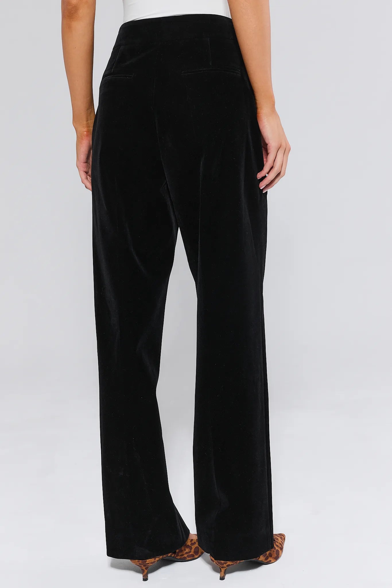 Black evie pants worn by a person on a white background