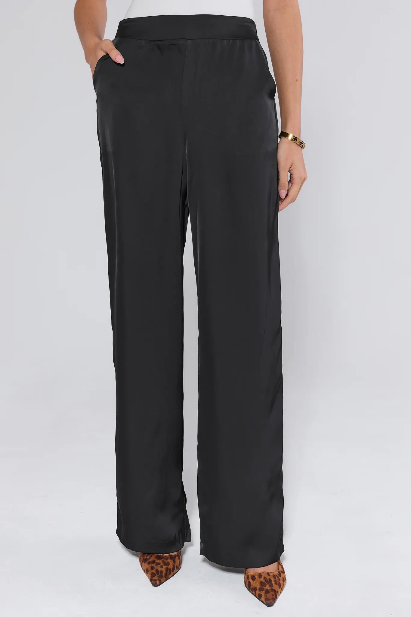 Emerson Wide Leg Trousers worn by a person on a white background