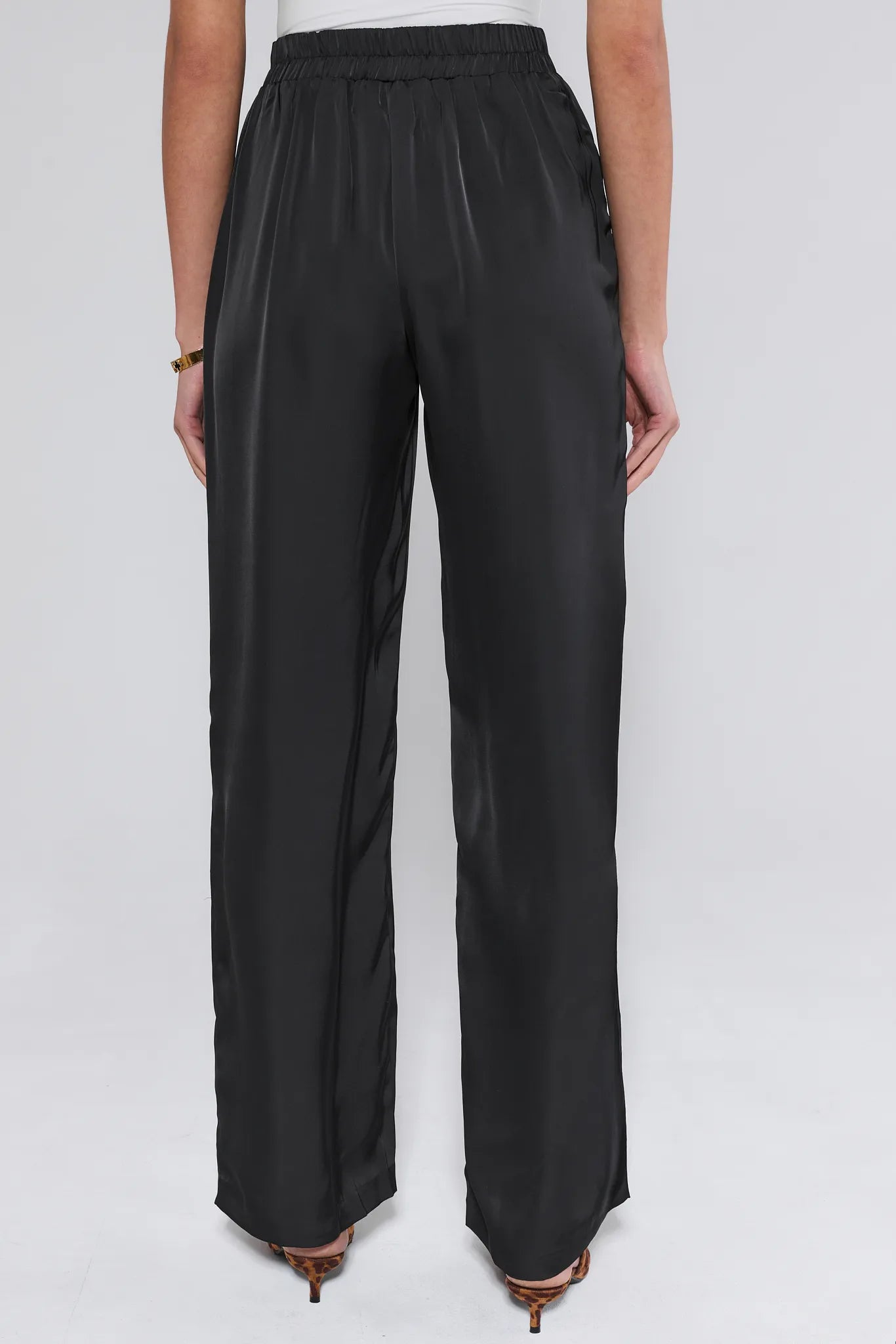 Emerson Wide Leg Trousers worn by a person on a white background