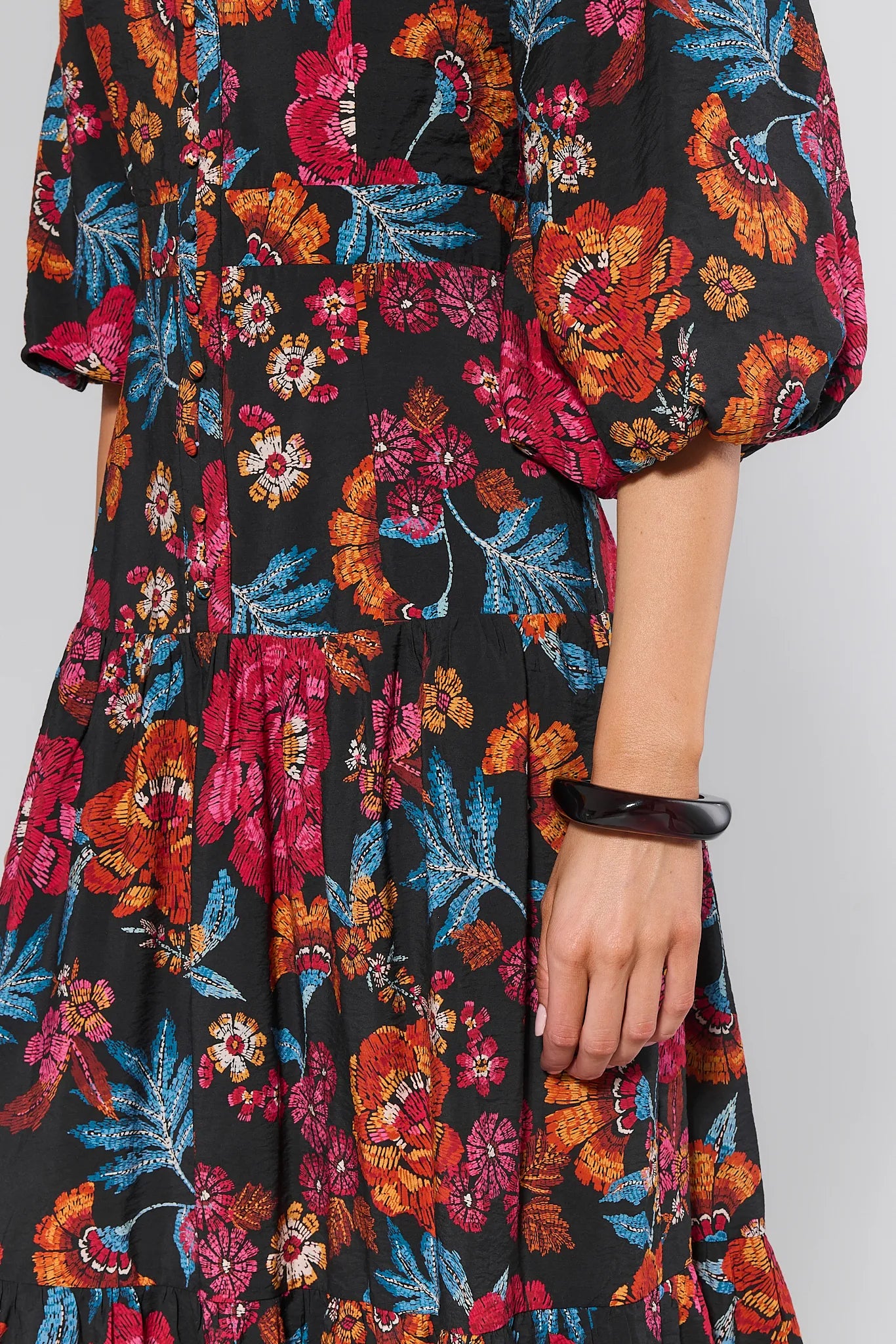 Colorful floral dress with a plain background
