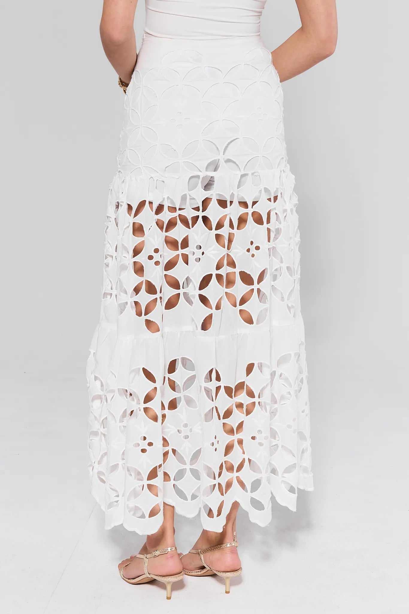 Cynthia White Cutout Maxi Skirt worn by a women on a white background