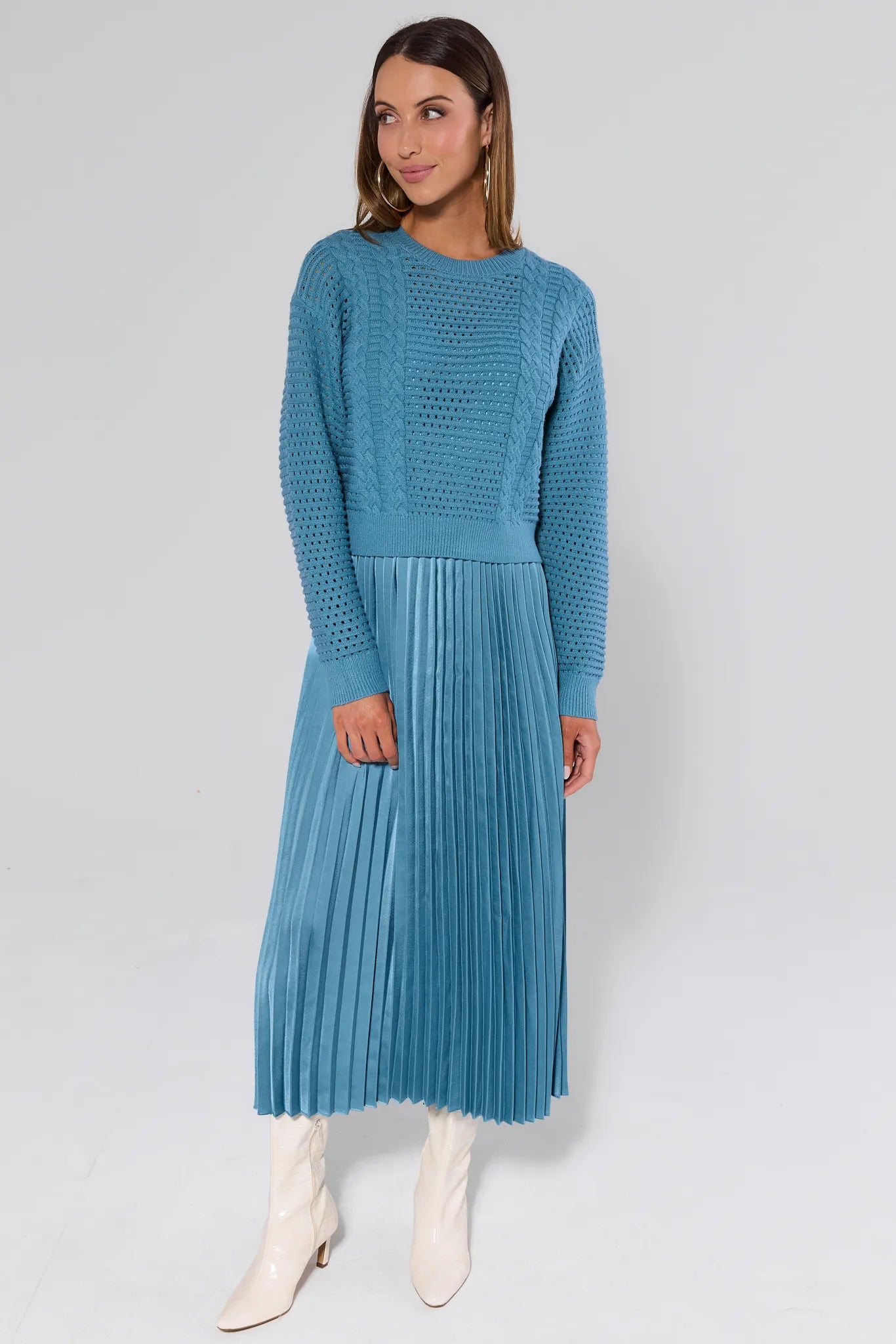 Woman wearing a Gabbie Dusty Blue Midi Dress on a white background