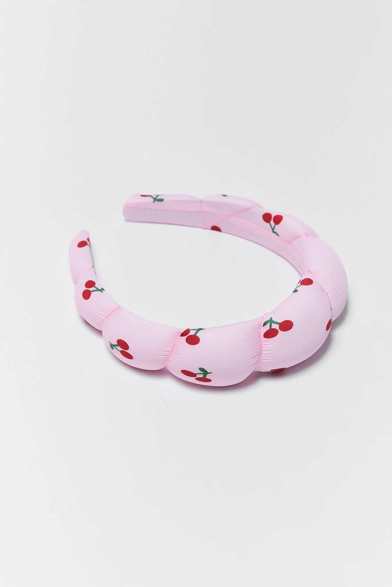 cherry headband on white background