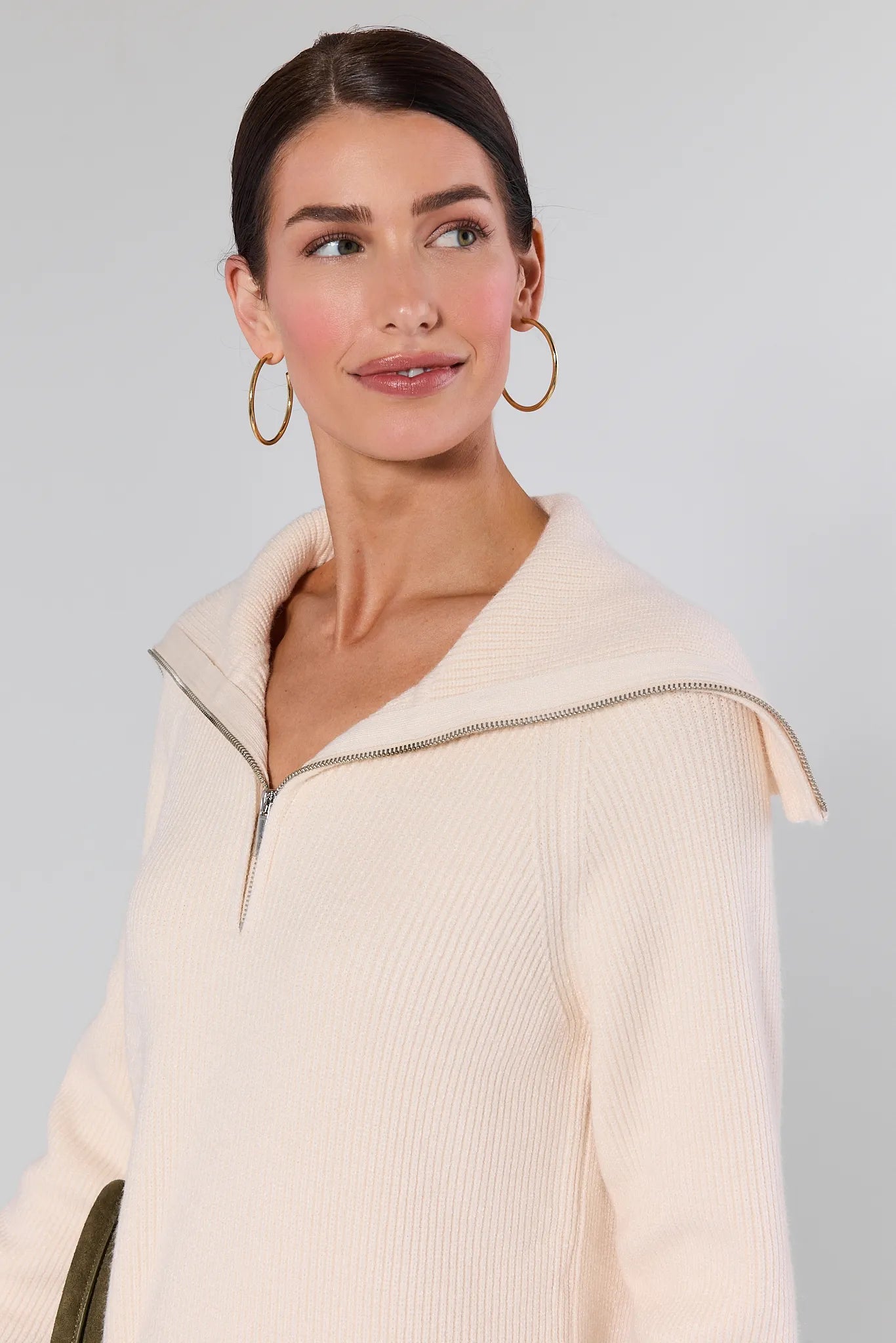 Woman wearing a Aubrey Ribbed Knit Sweater Dress with a zipper detail on a plain background