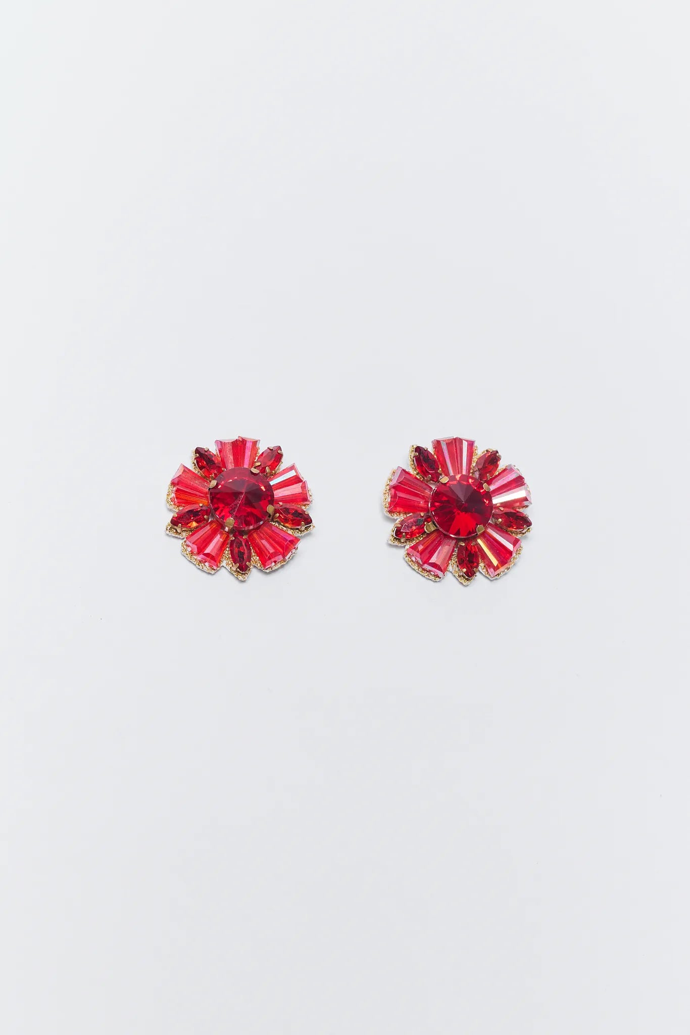Pair of Rita Red Crystal Earrings on a light gray background