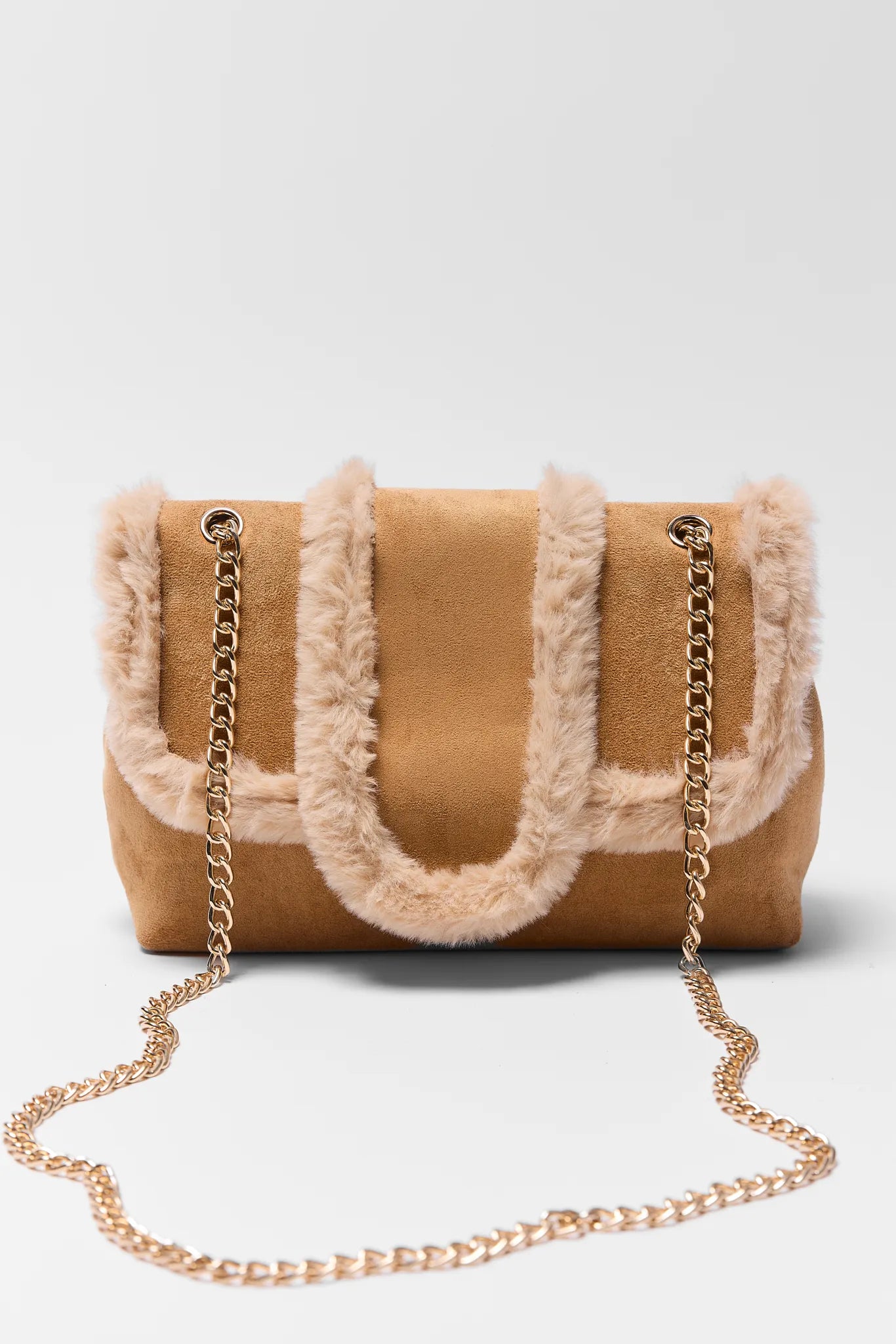 Brown handbag with fur trim and gold chain on a white background Tori Tan Suede Shoulder Bag
