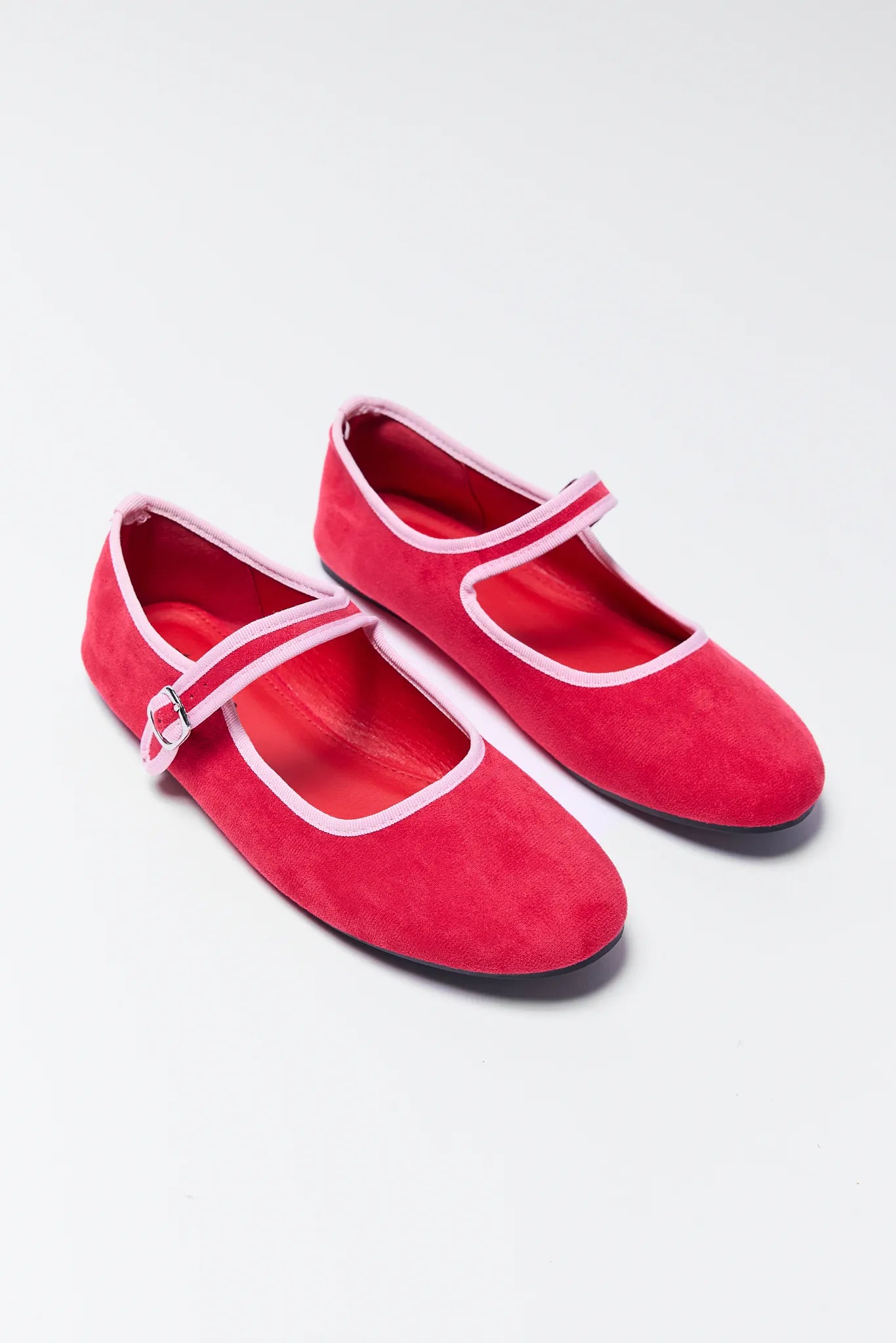 Ellie Red Velvet Flats with white straps on a light gray background