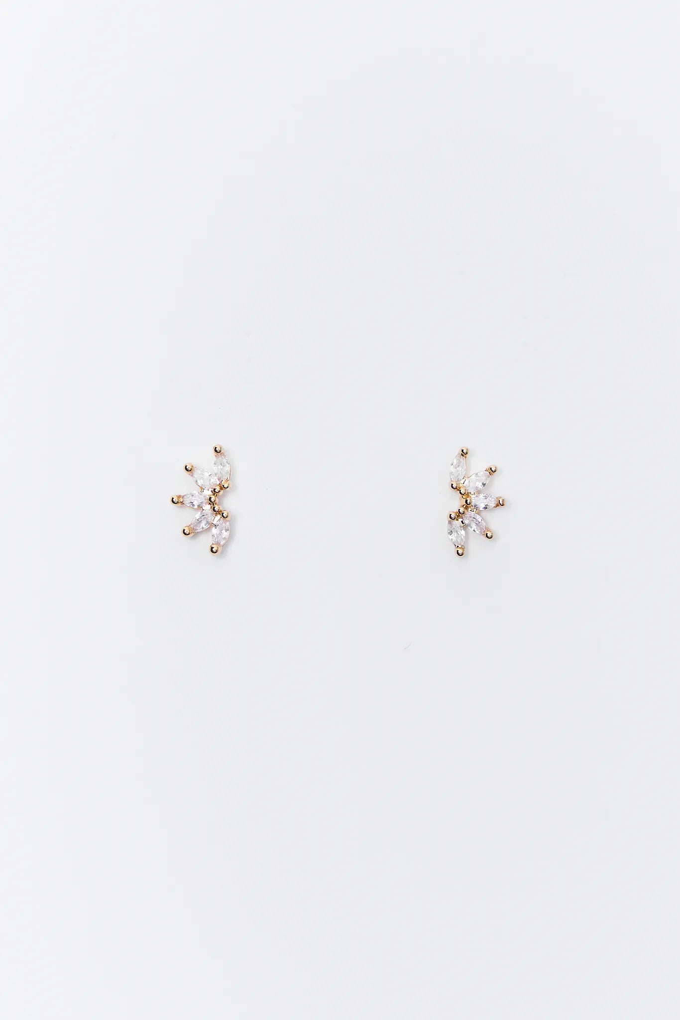 Pair of delicate Jones Rhinestone Stud Earrings on a light gray background