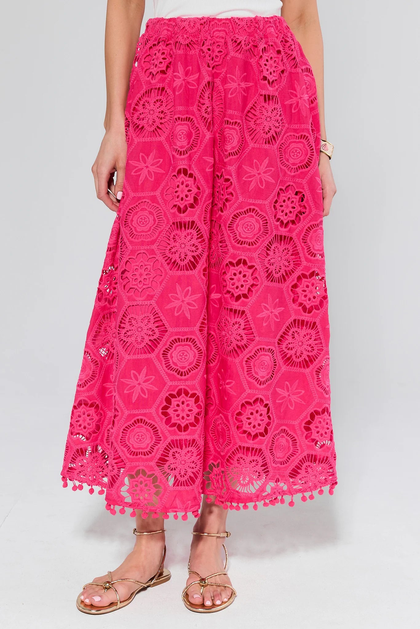 Pink lace pants on a white background