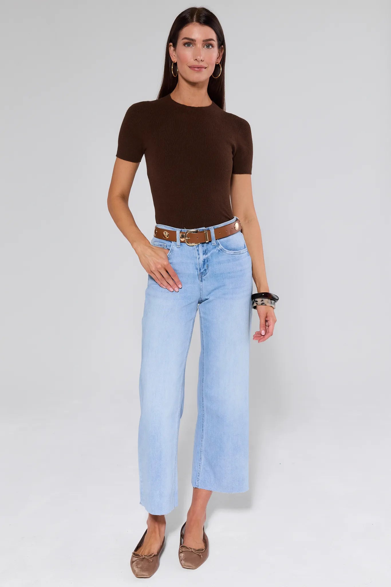Blake Light Wash Wide Leg Jeans worn by a person on a white background
