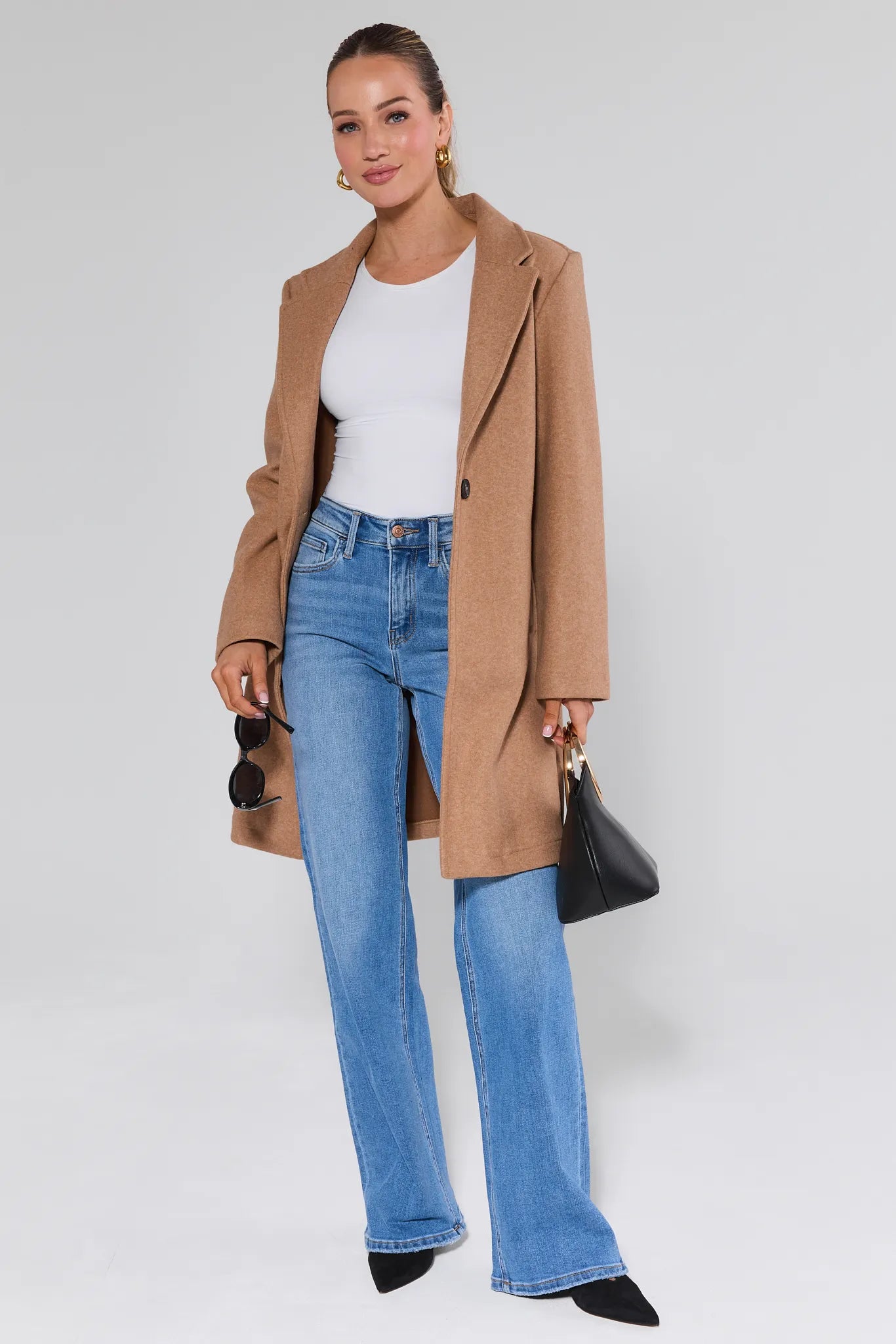 Brighton Medium Wash Straight Leg Jeans worn by a person on a white background