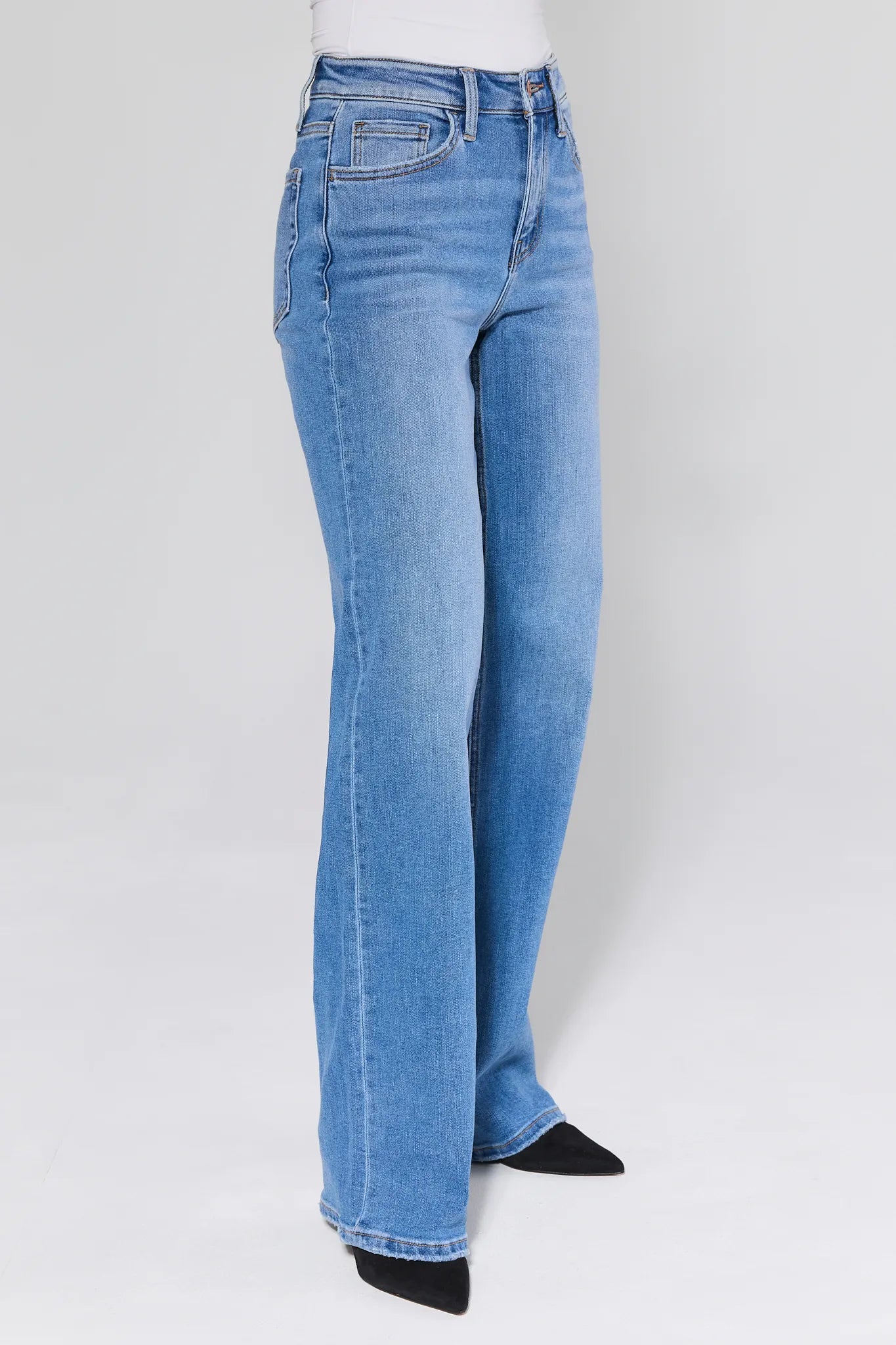 Brighton Medium Wash Straight Leg Jeans worn by a person on a white background