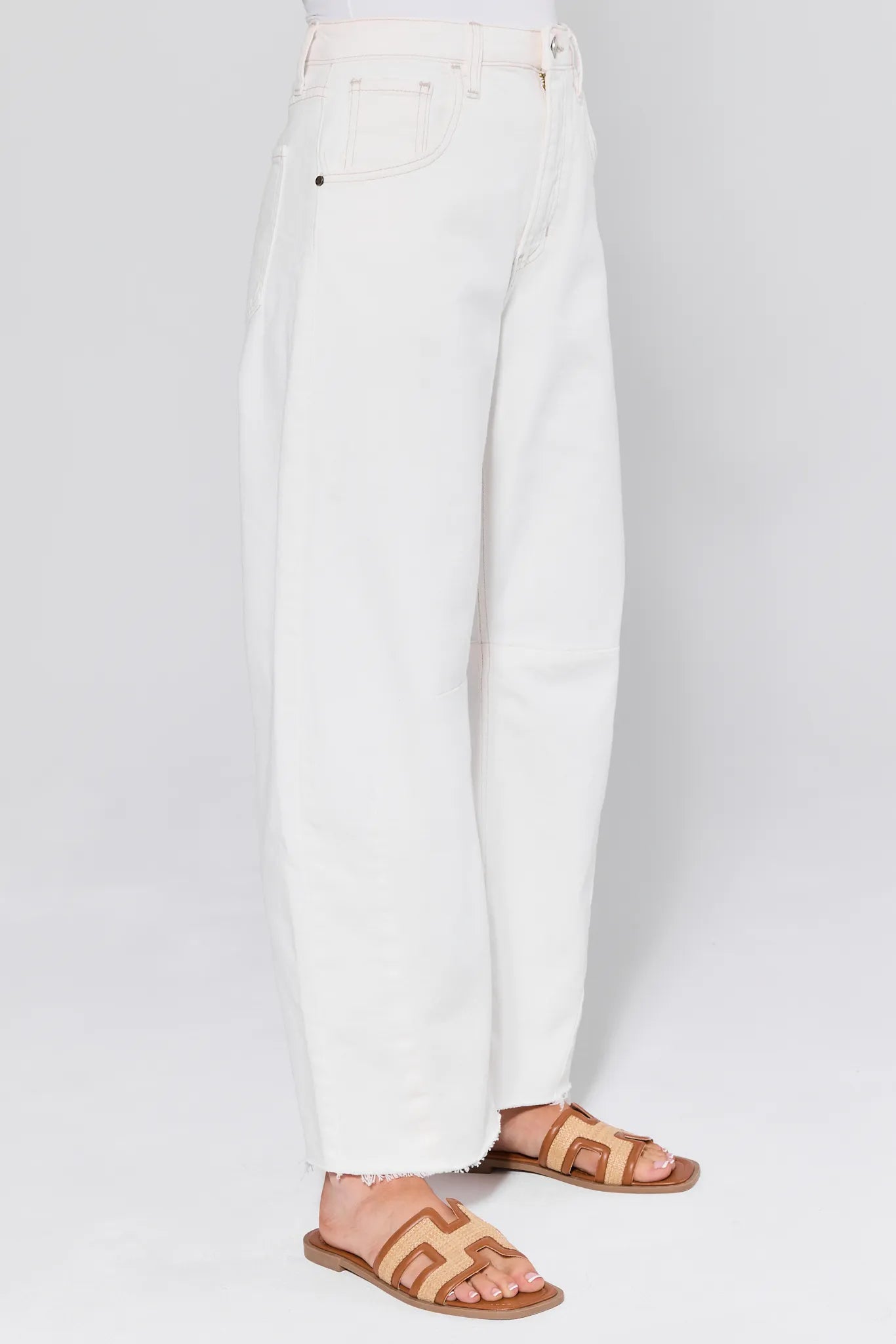 Blaine White Barrel Jeans worn by a person on a white background