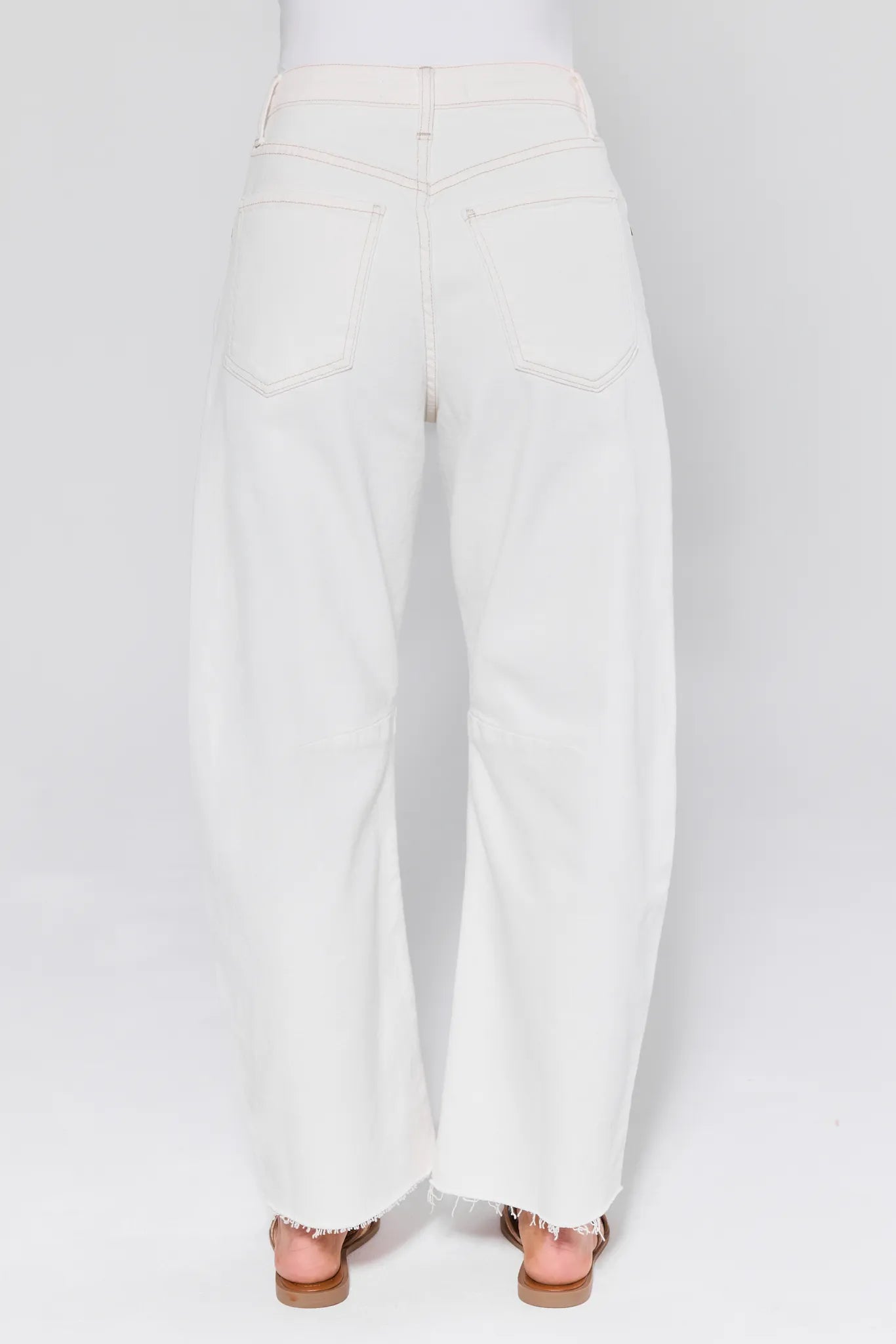 Blaine White Barrel Jeans worn by a person on a white background