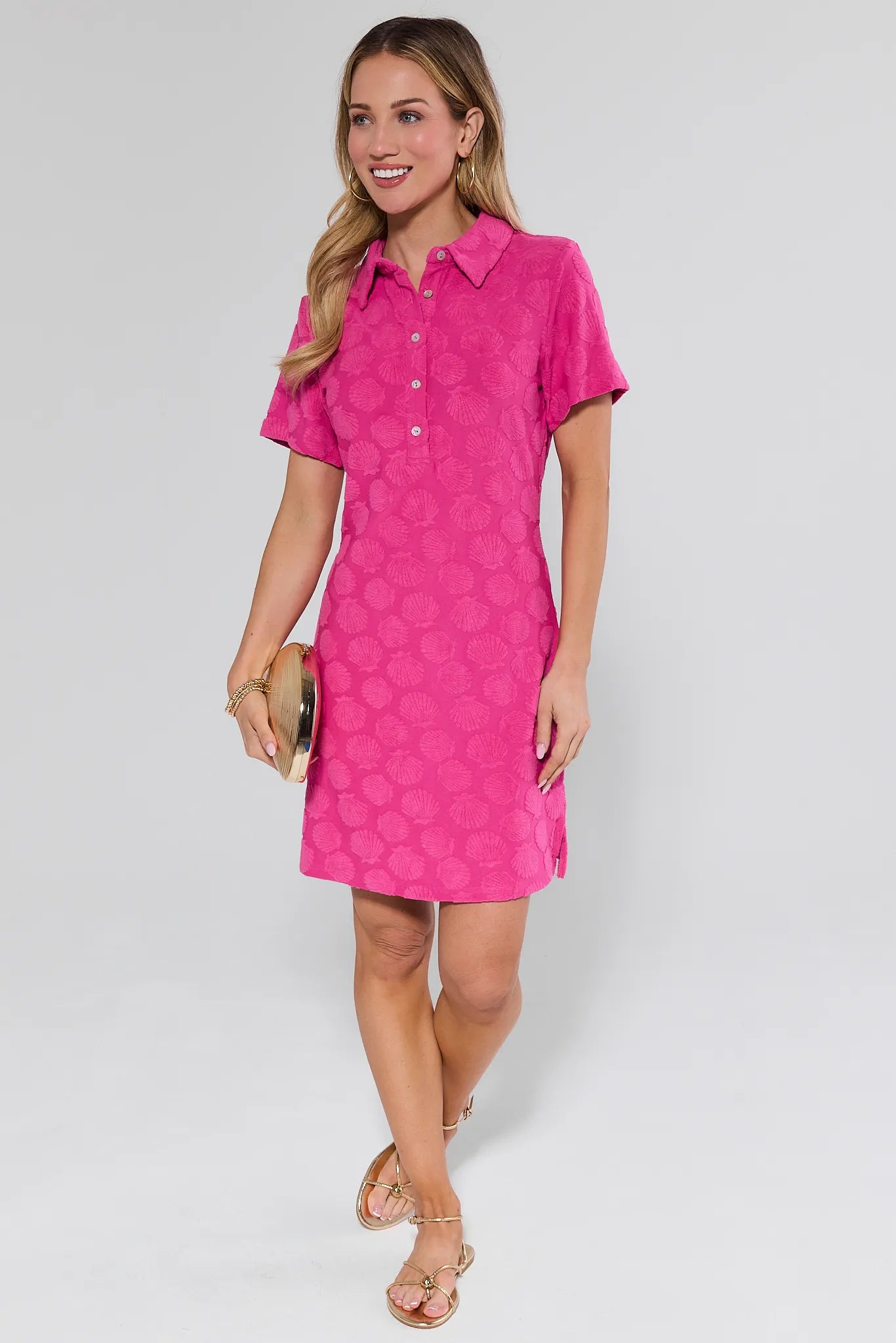 Woman wearing a pink dress with a white background