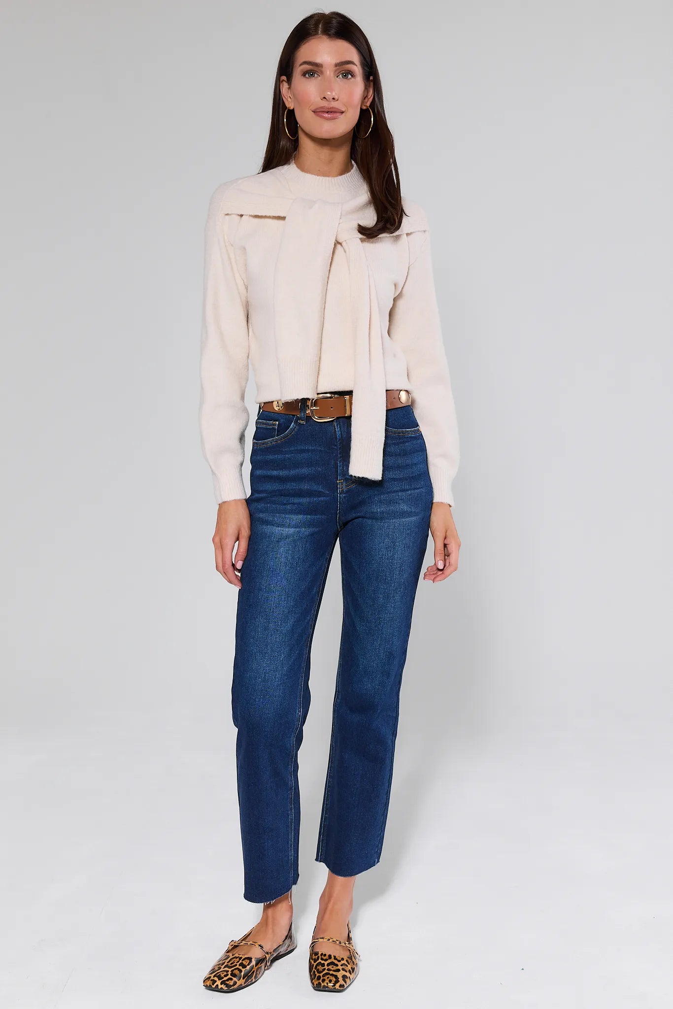 Person wearing Lucy Dark Wash Straight Leg Jeans on a white background