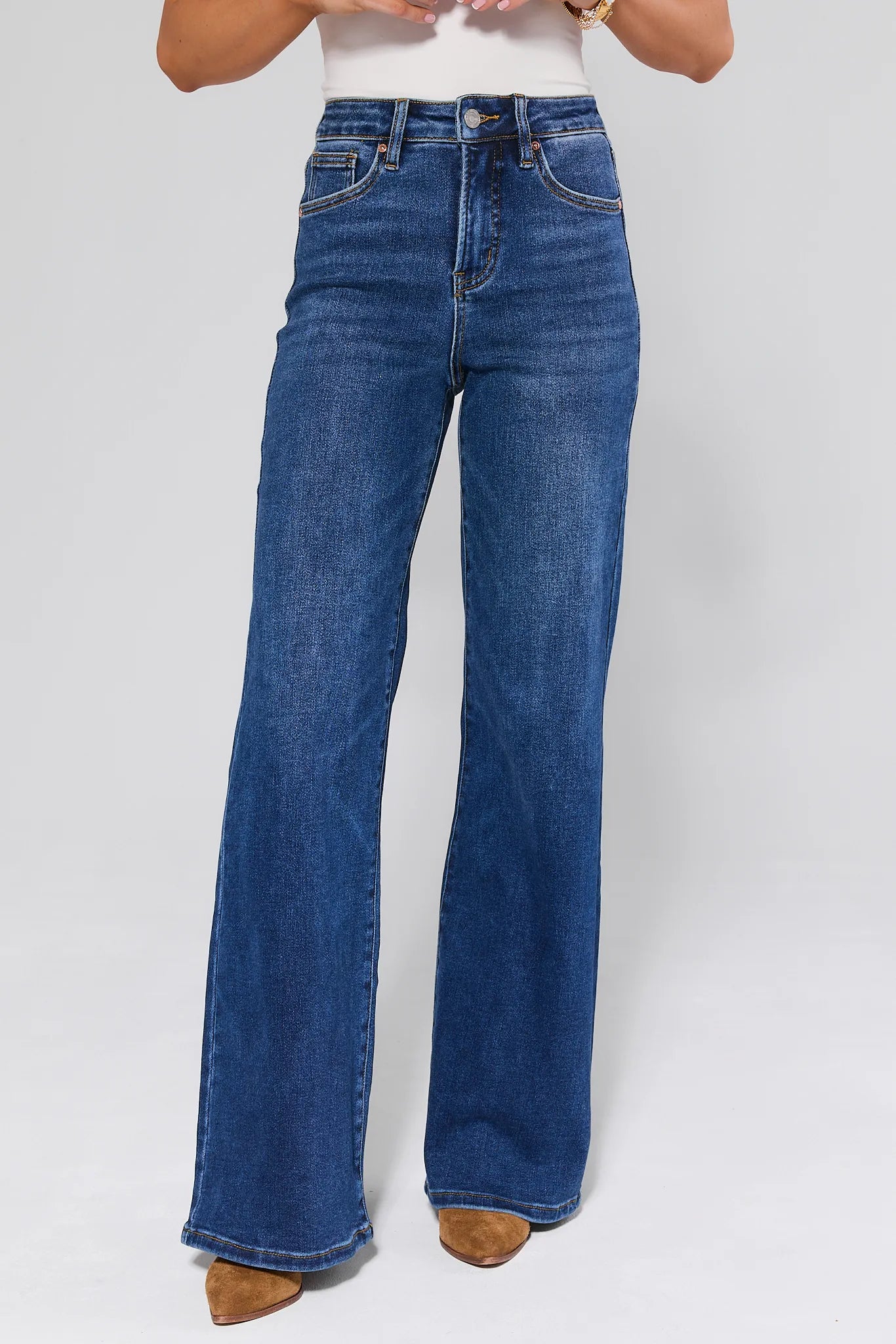 Linda Dark Wash Wide Leg Jeans worn by a person on a white background