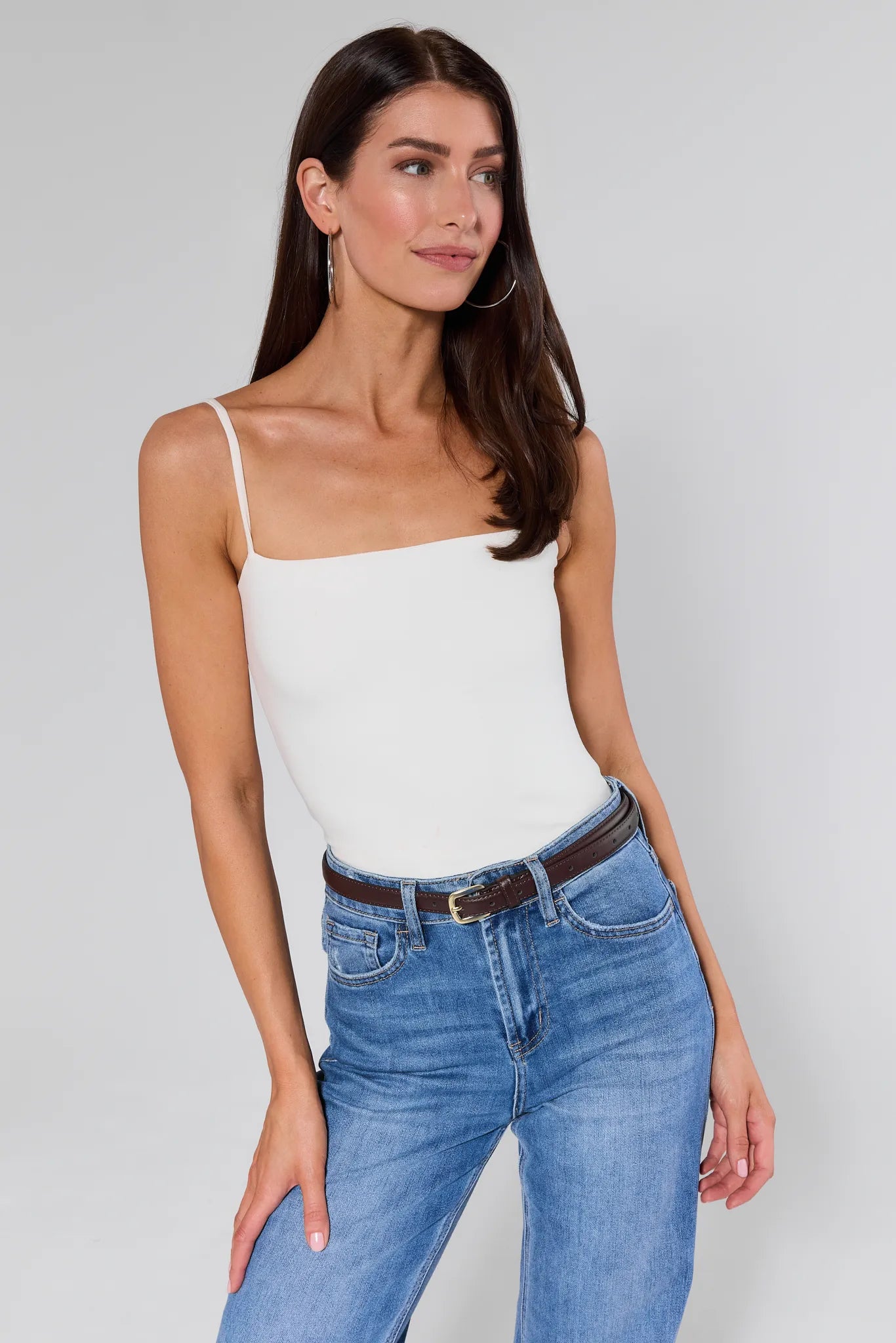 Aubrey Brown Buckle Belt on women wearing white top and blue jeans