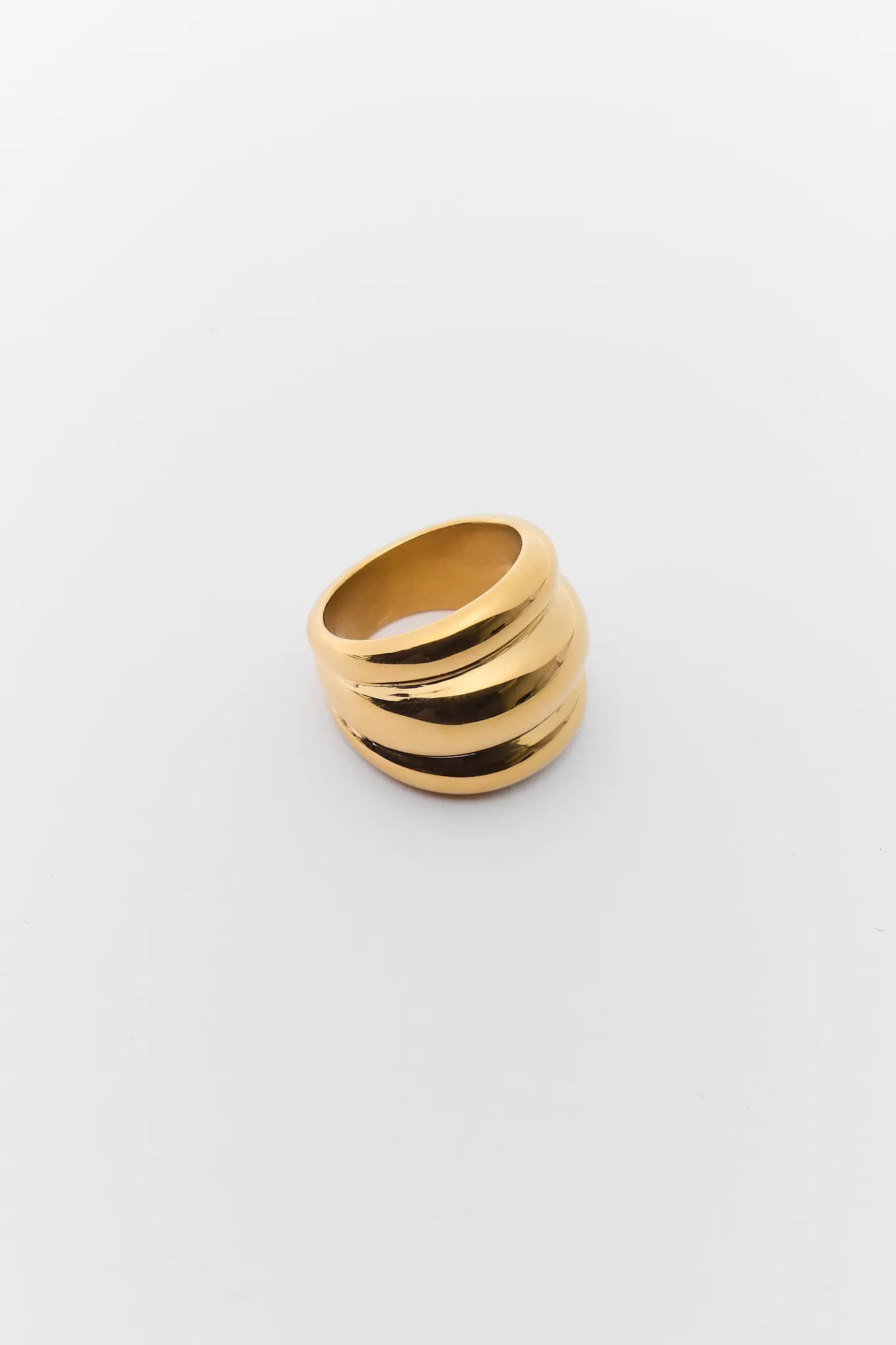 Gold ring with three stacked bands on a white background Daley Gold Fluted Ring