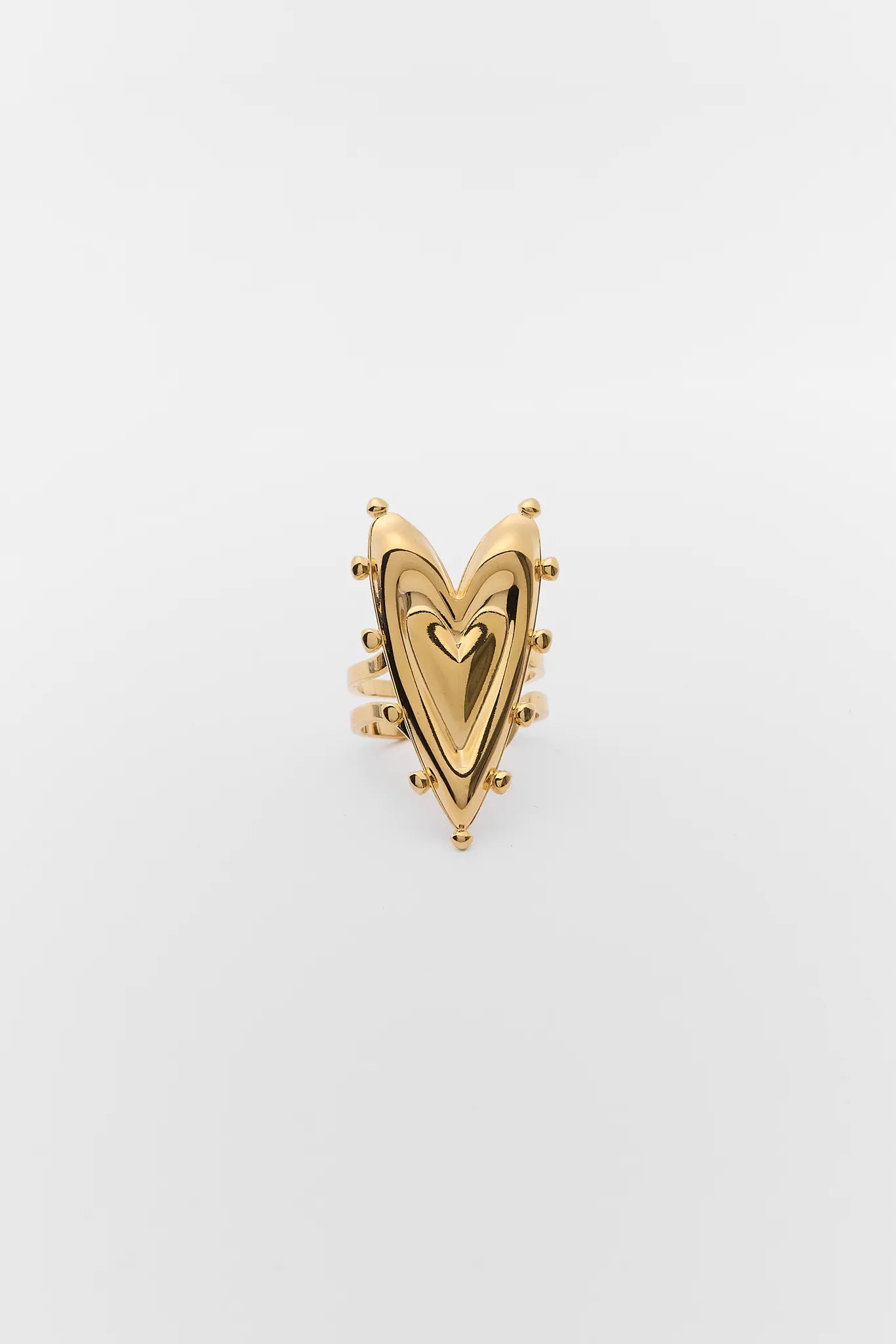 Vivana Gold Heart Ring on a light gray background