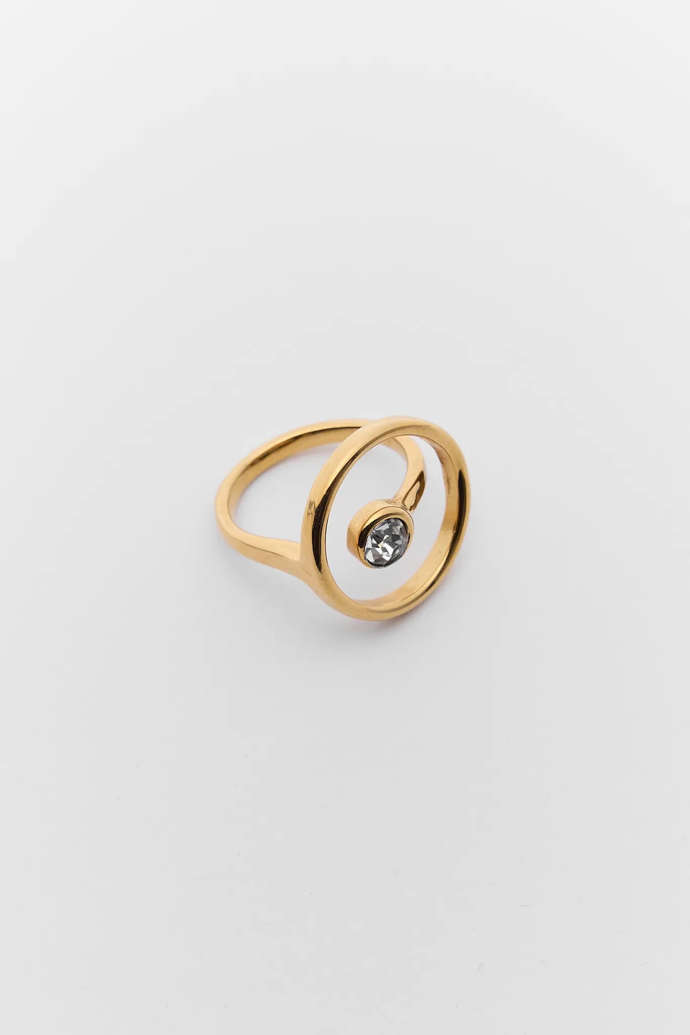 Louisa Gold Circle Rhinestone Ring on a light gray background