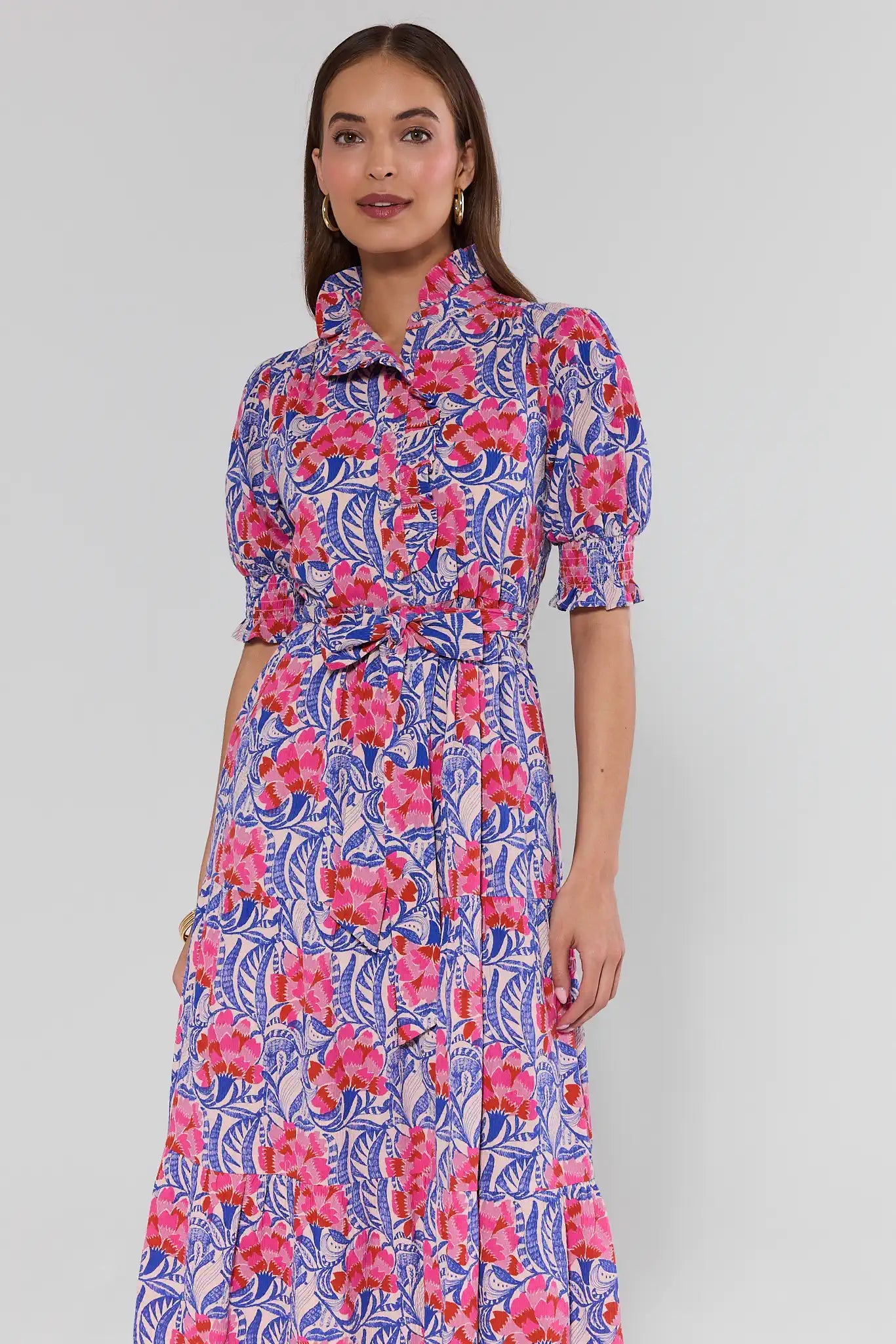 Woman wearing a floral dress with a white background