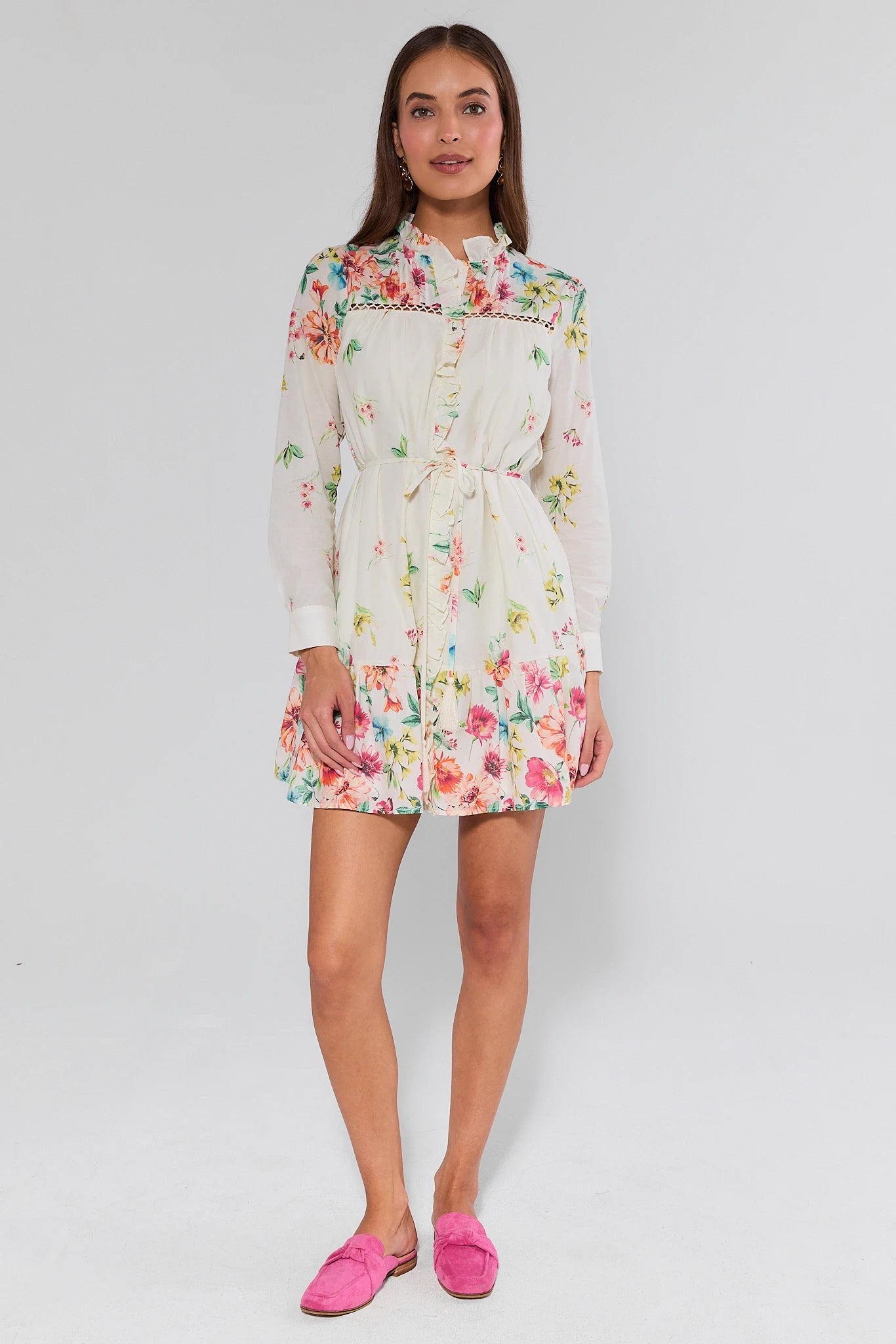 Woman wearing a floral dress on a white background