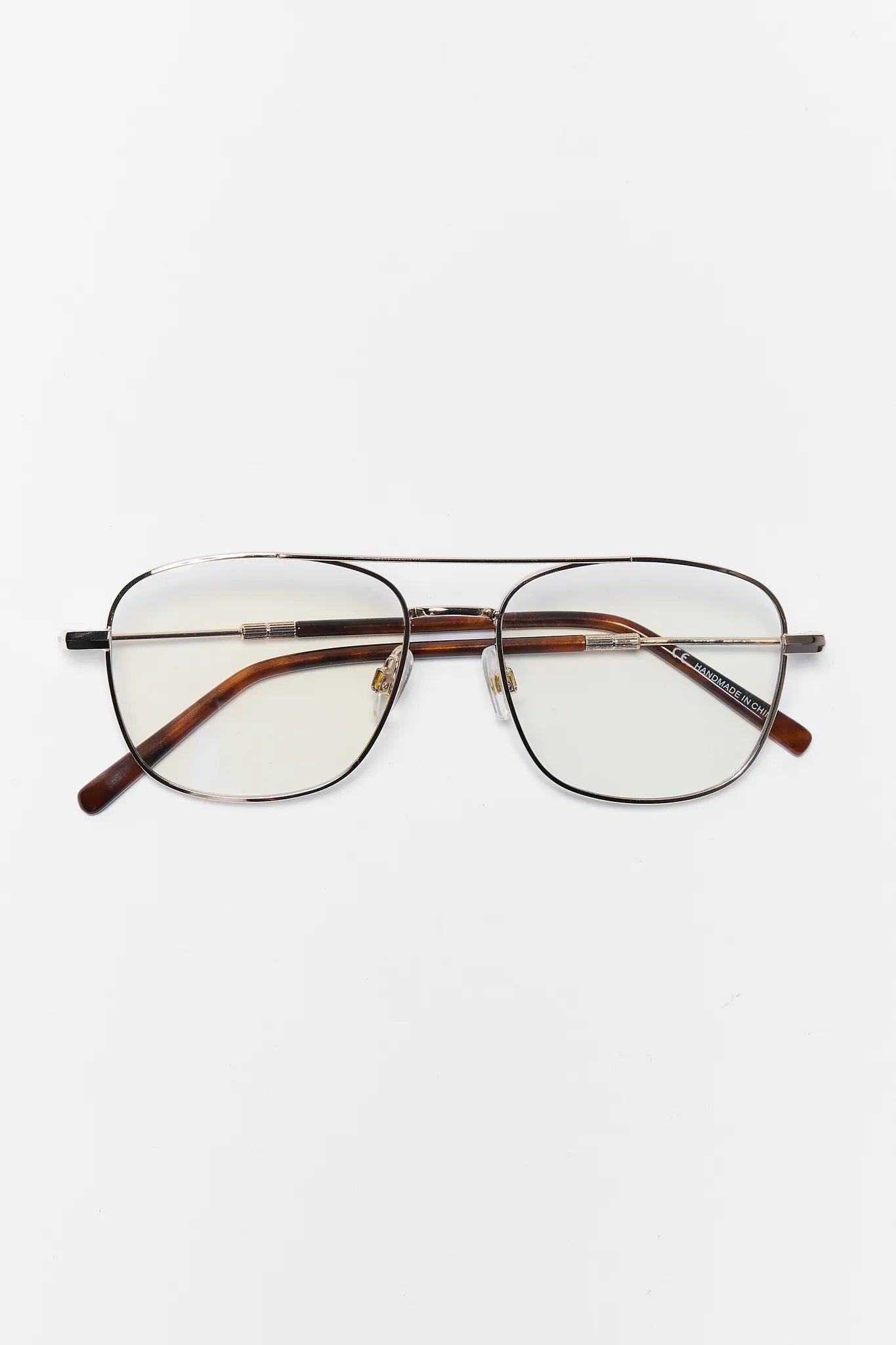 glasses with tortoise details on white background