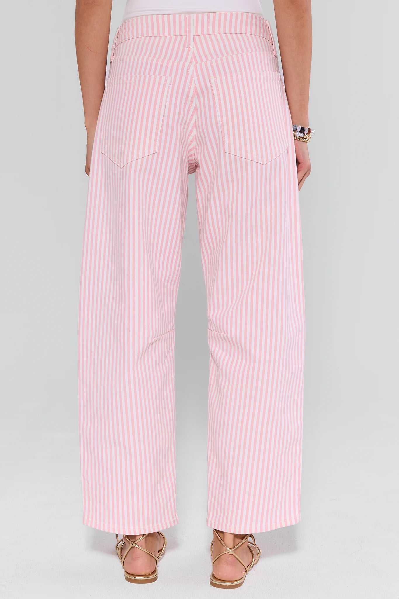 View 2: Pink striped pants worn by a person on a white background