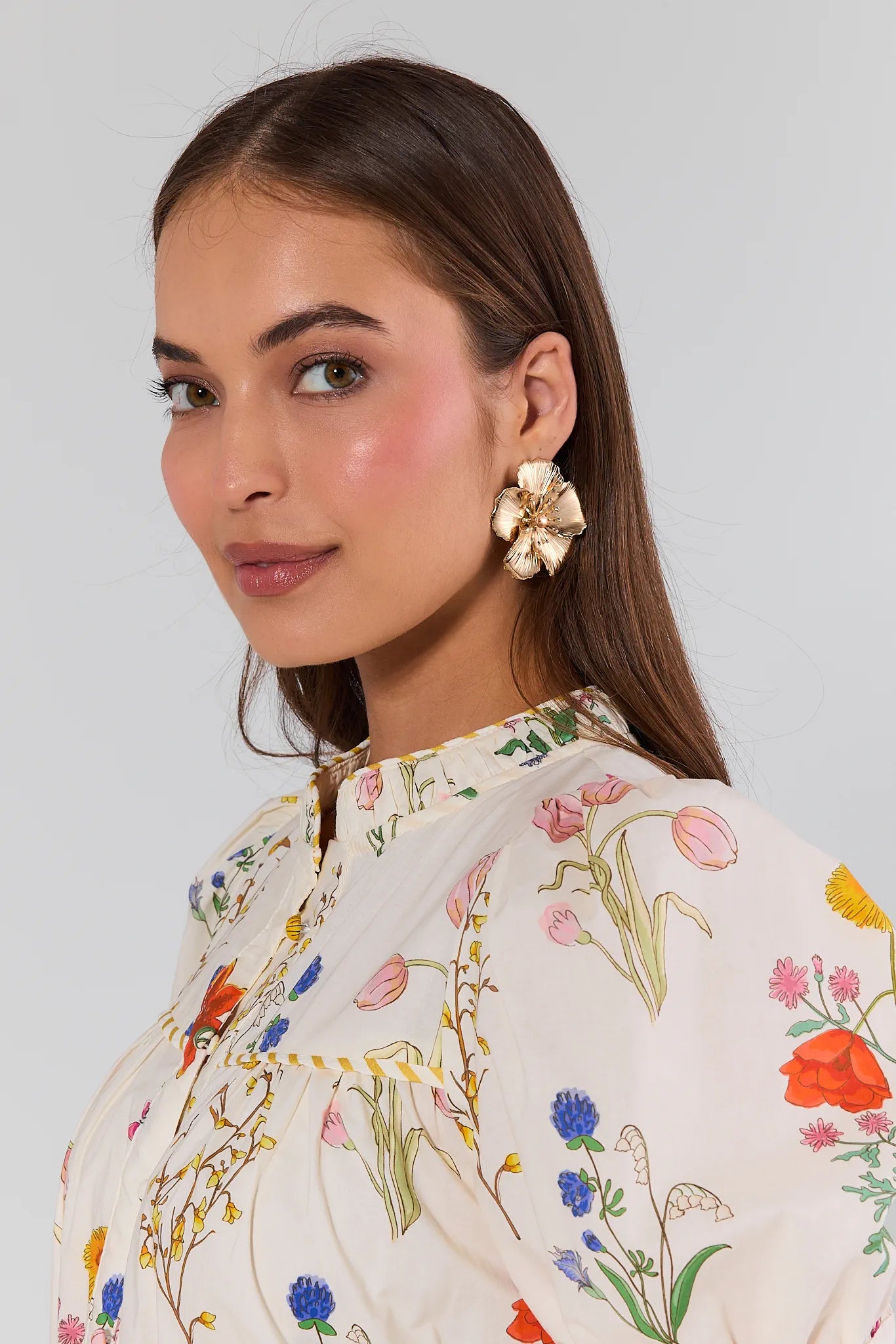 woman wearing Andrea Gold Flower Stud Earrings