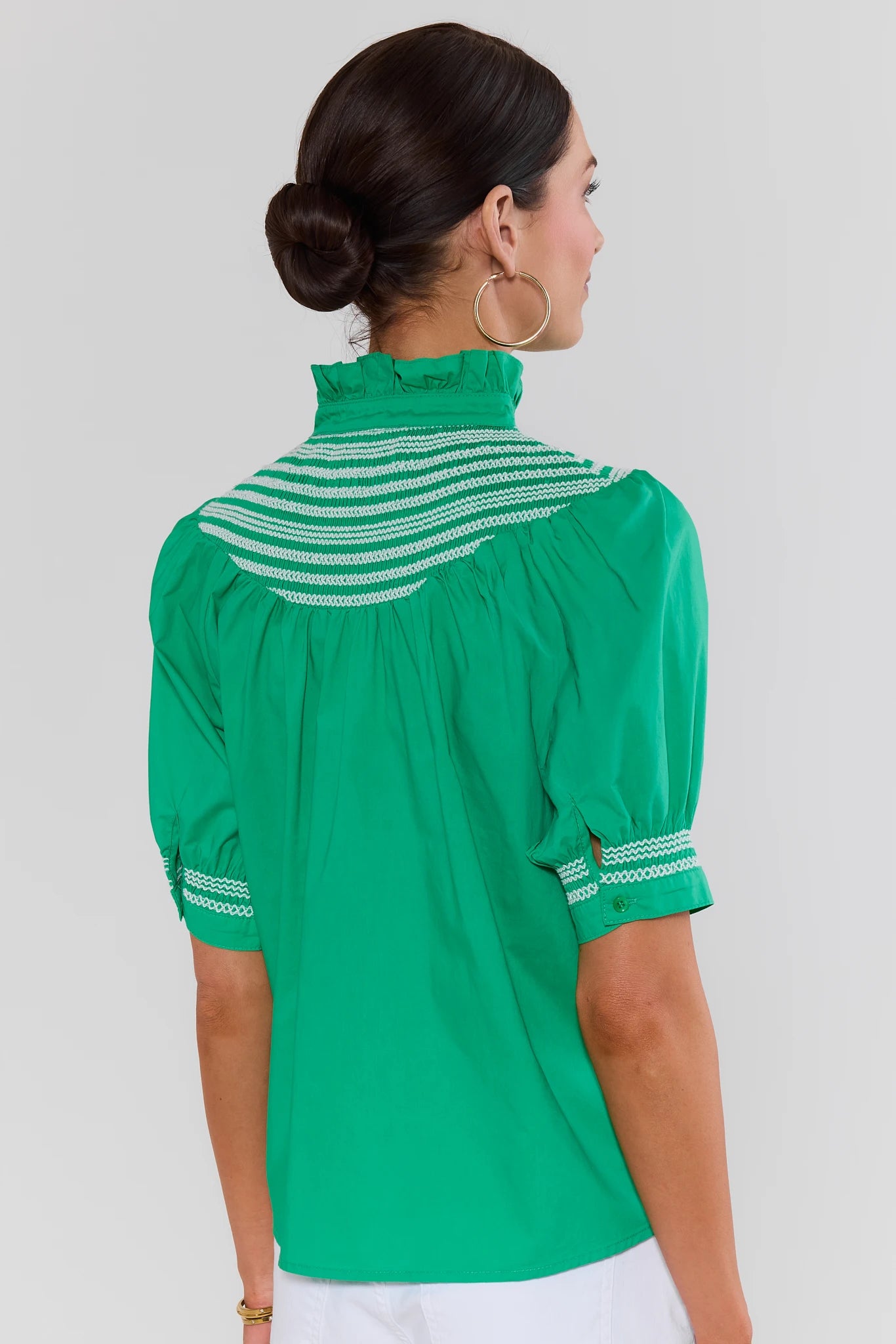 woman standing wearing yvonne top green