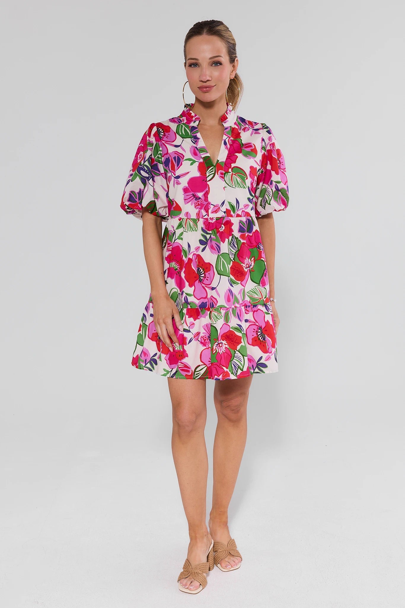 Woman wearing a floral dress on a white background