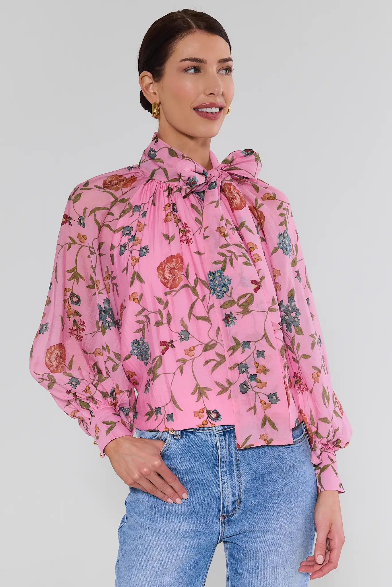woman wearing long sleeve pink floral top