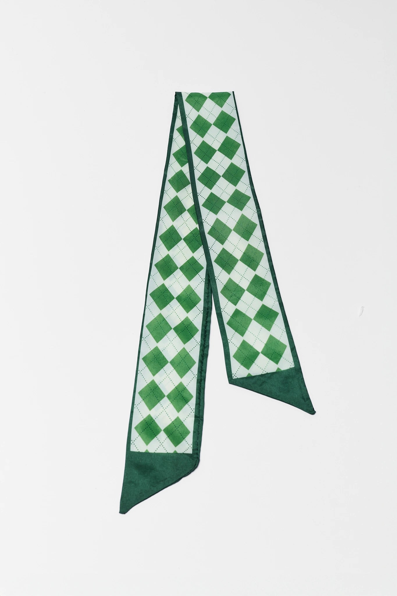 Green and white checkered scarf on a white background