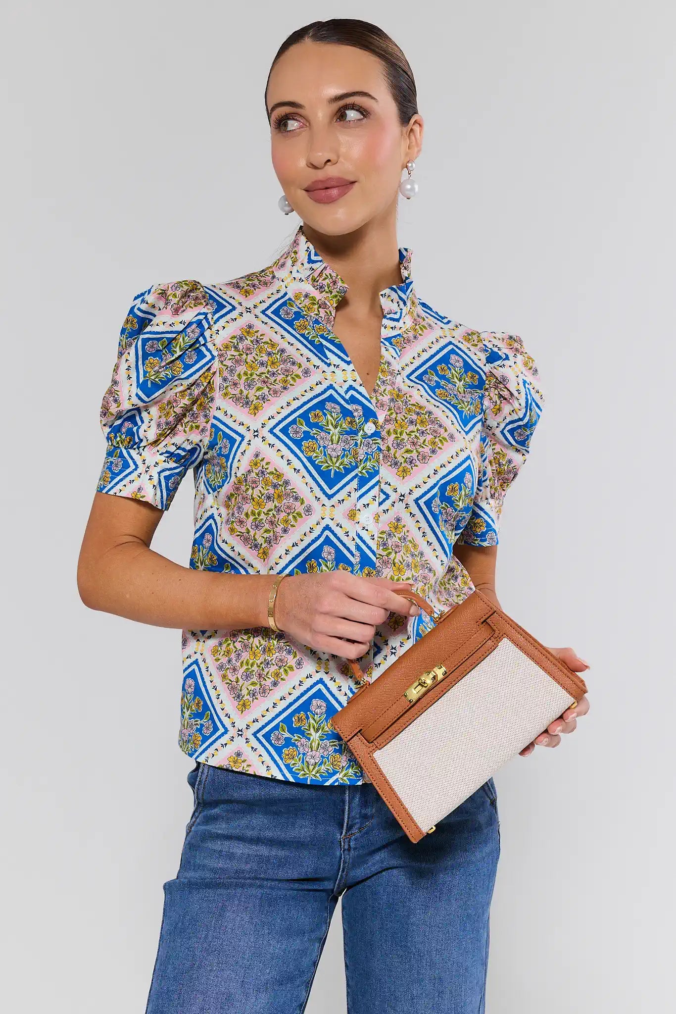 woman holding Helen Camel Faux Leather Bag on a white background