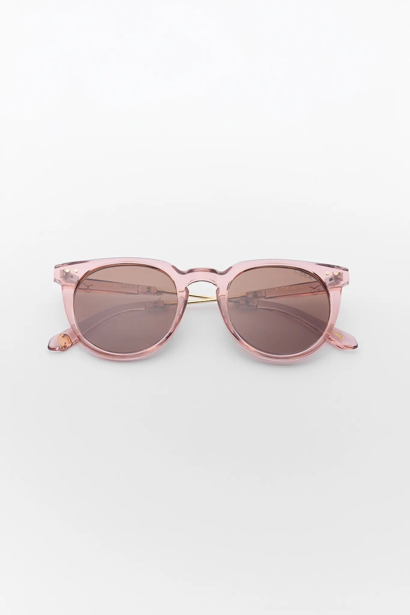 Pink sunglasses with a clear frame on a white background
