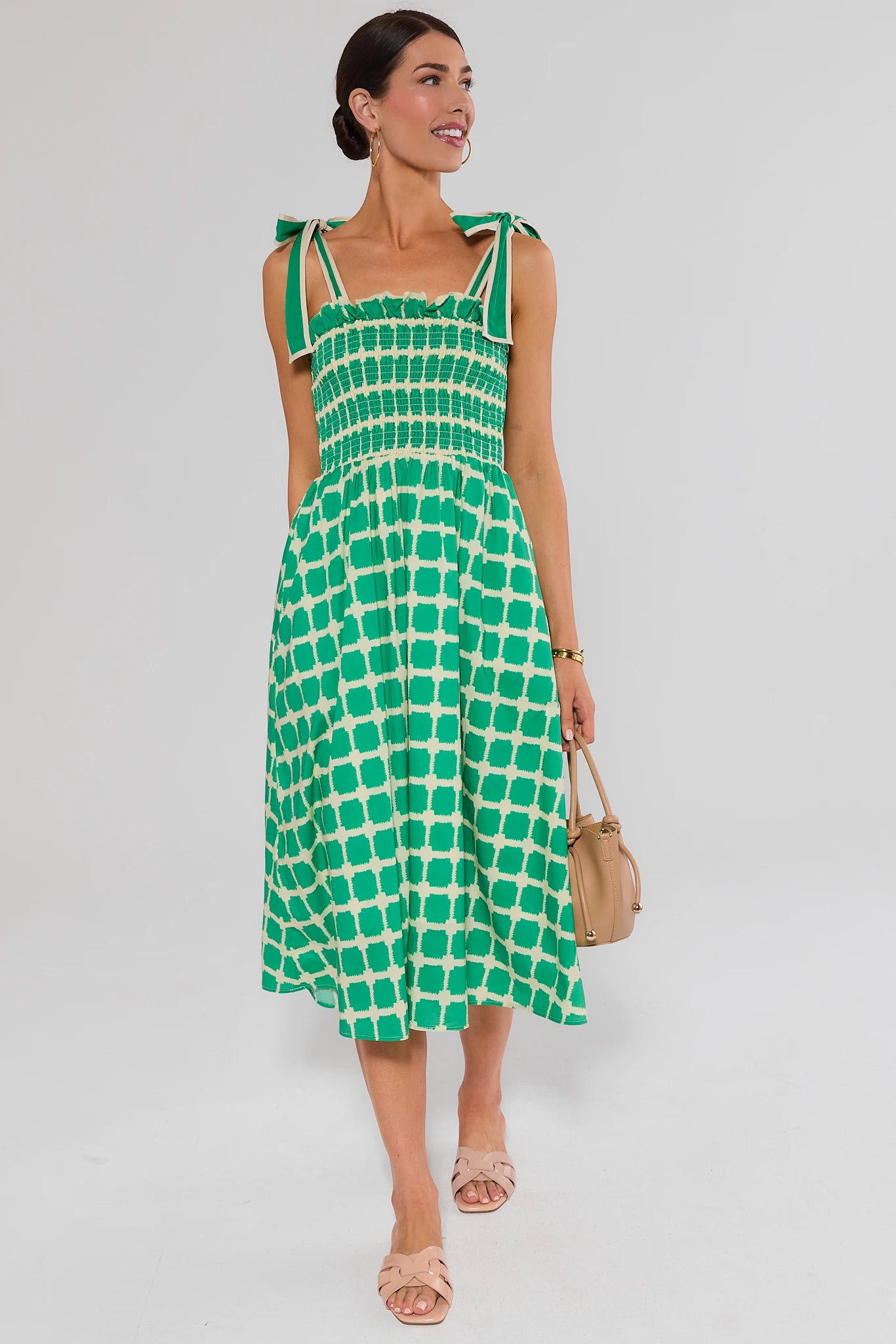full body woman wearing green talia dress on white background