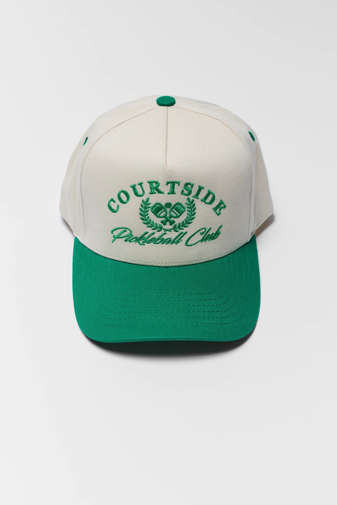 Cap with 'Courtside Pickleball Club' text on a white background