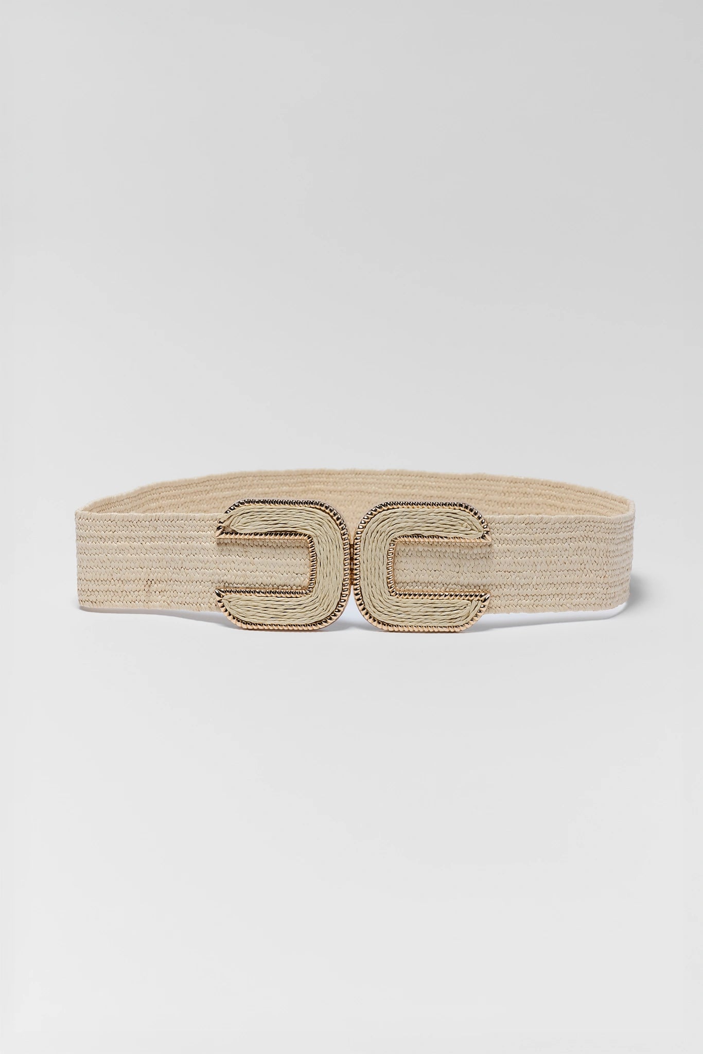 Beige belt with gold buckle on a light gray background