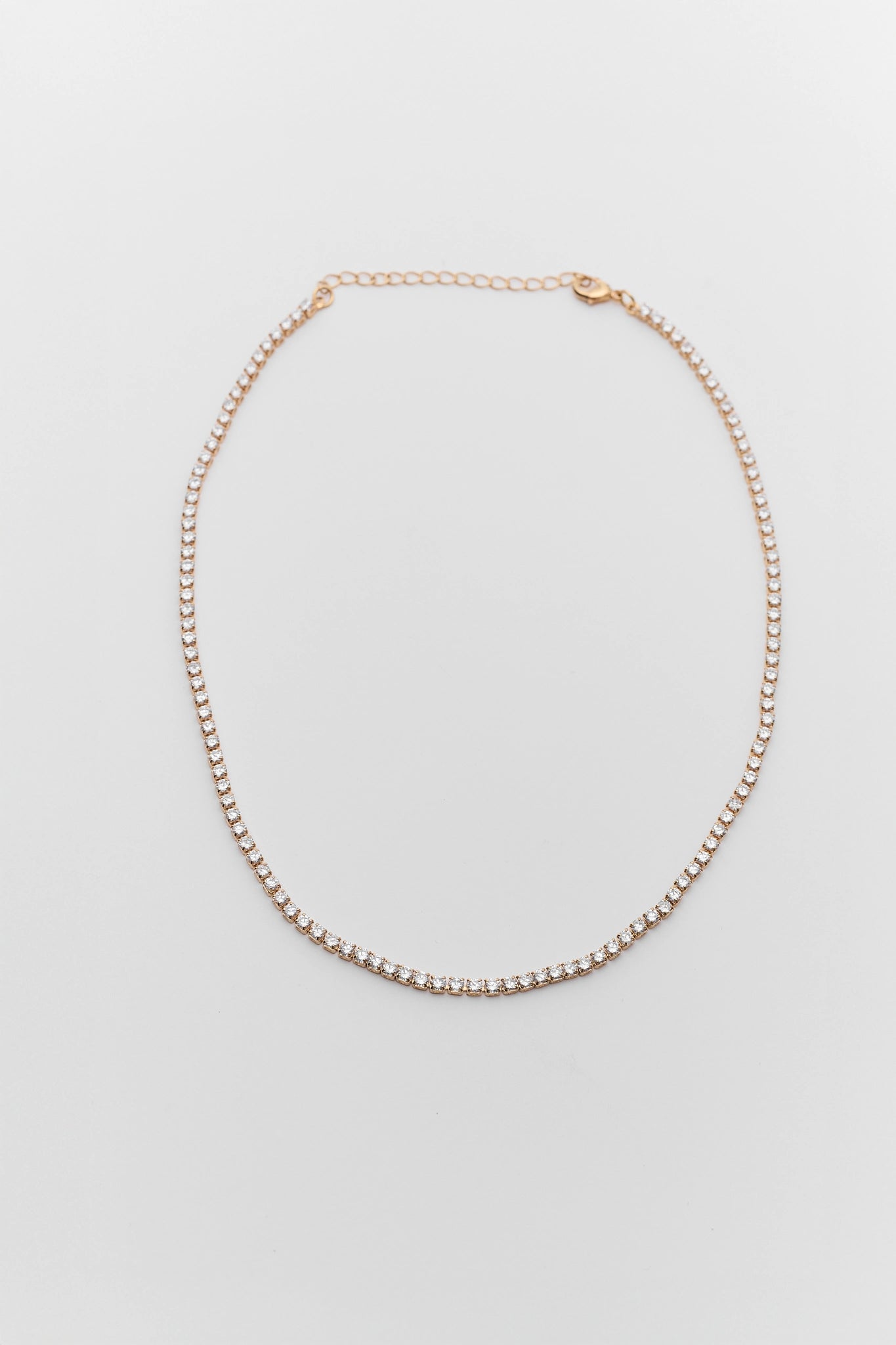 Gold Tennis Necklace on white background
