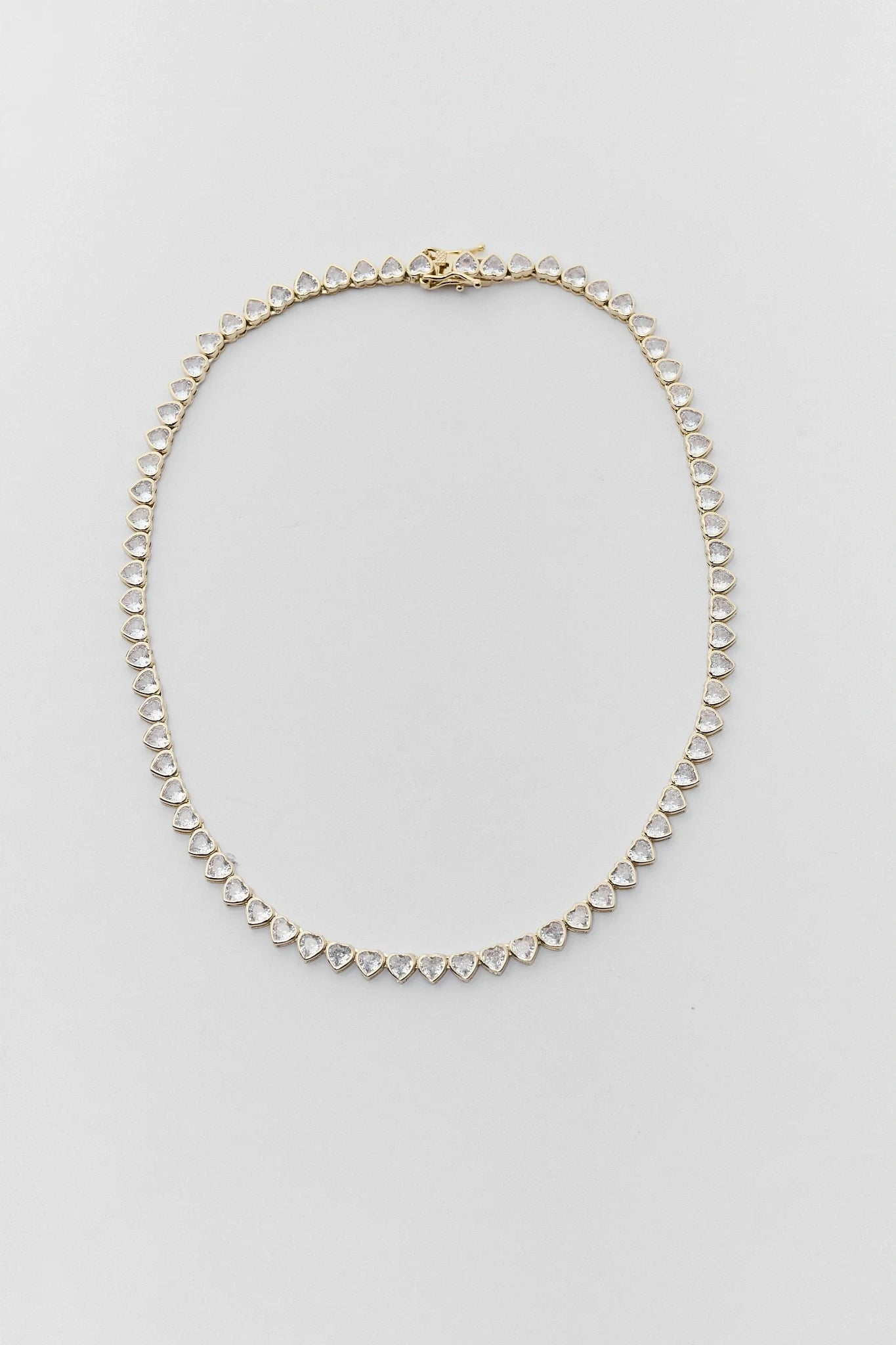 Pearl necklace on a light gray background